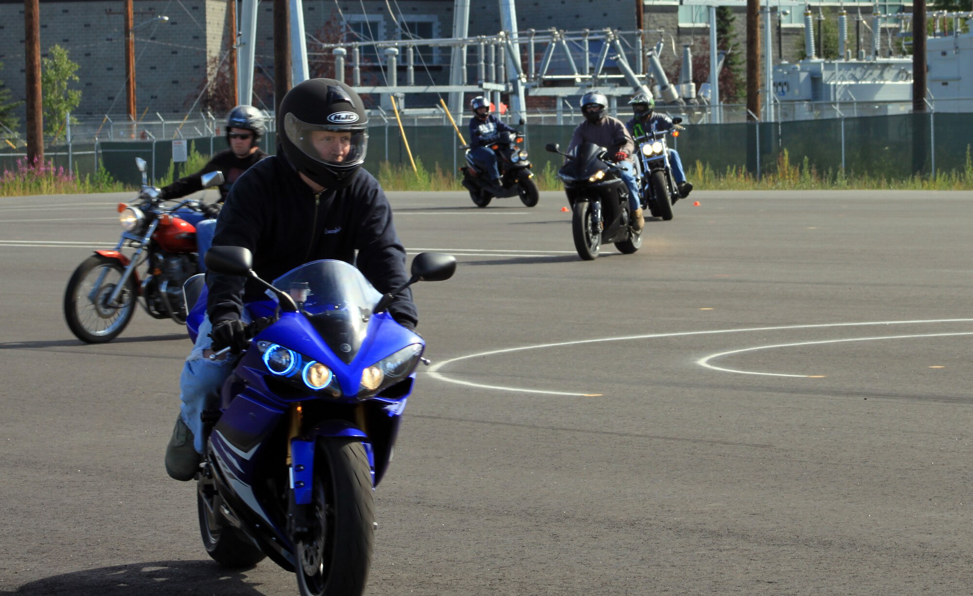 Motorcyclists follow a path during a motorcycle safety course August 6, 2011, Fort Wainwright, Alaska. The course is mandatory every three years for assigned motorcycle riders so they can practice safe riding techniques. (Photo by Ted Howk)