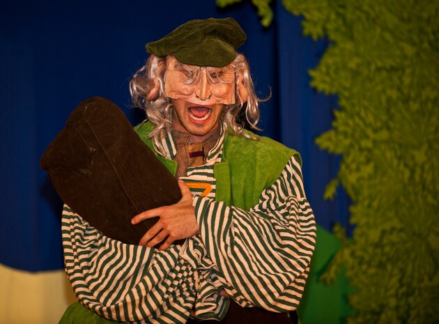 Ross Egan, Missoula Children's Theater tour actor and director, plays the Giant in the MCT production of "King Arthur's Quest" Aug. 12, 2011, in the Base Theater at Nellis Air Force Base, Nev. This musical, conceived and written by Michael McGill, MCT executive director, tells a story of King Arthur, the Knights of the Round Table and the people of Camelot and how they deal with troubles that include being visited by the ghost of King Arthur's father, being confronted by a giant and being terrorized by a dragon. (U.S. Air Force photo by Airman 1st Class George Goslin/Released)