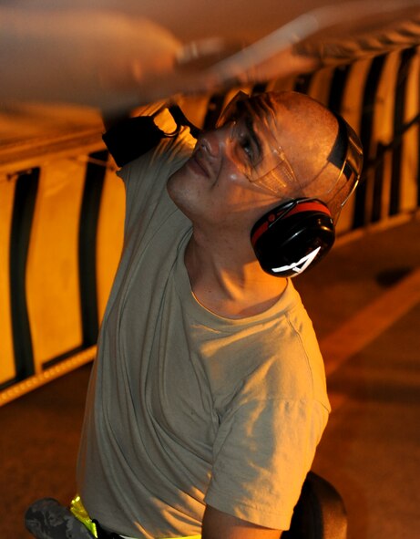 Airman 1st Class Michael Applegate, 961st Aircraft Maintenance Unit electrical environmental, changes a bypass valve on an E-3 Sentry, an airborne warning and control system aircraft, during routine maintenance Aug. 16 Kadena Air Base, Japan. The rotating radar dome has a range of more than 250 miles (375.5 kilometers) for low-flying targets and farther for aerospace vehicles flying at medium to high altitudes. (U.S. Air Force photo/ Airman 1st Class Brooke P. Beers)