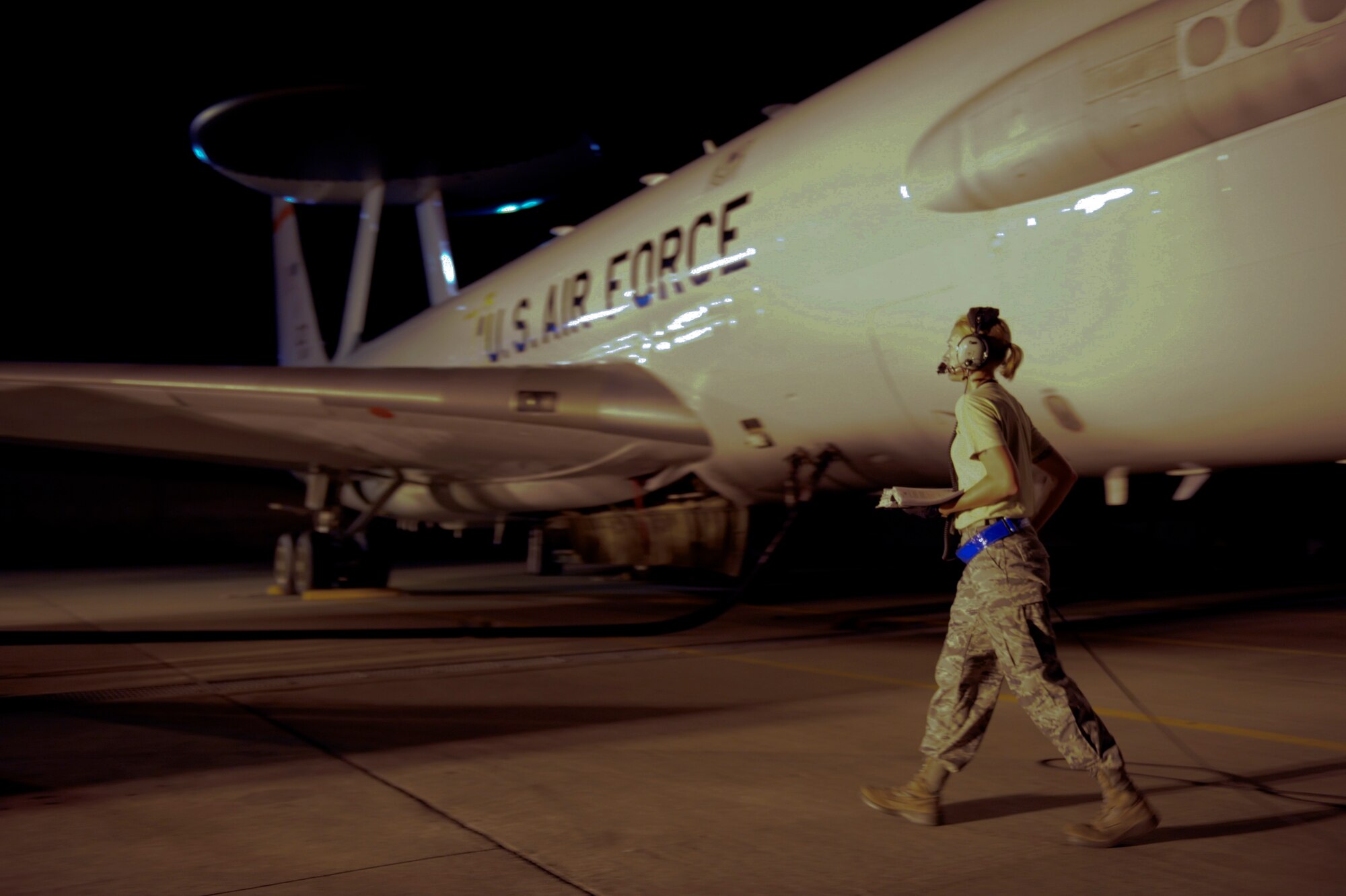 Staff Sgt. Sarah Thomas, 961st Aircraft Maintenance Unit hydraulics craftsman, refers to the training business area of refueling procedures during the refueling of an E-3 Sentry, an airborne warning and control system aircraft, Aug. 16 at Kadena Air Base, Japan. The procedures in the TBA are followed step-by-step to ensure no mishaps occur, which may cause delays. (U.S. Air Force photo/ Airman 1st Class Brooke P. Beers)