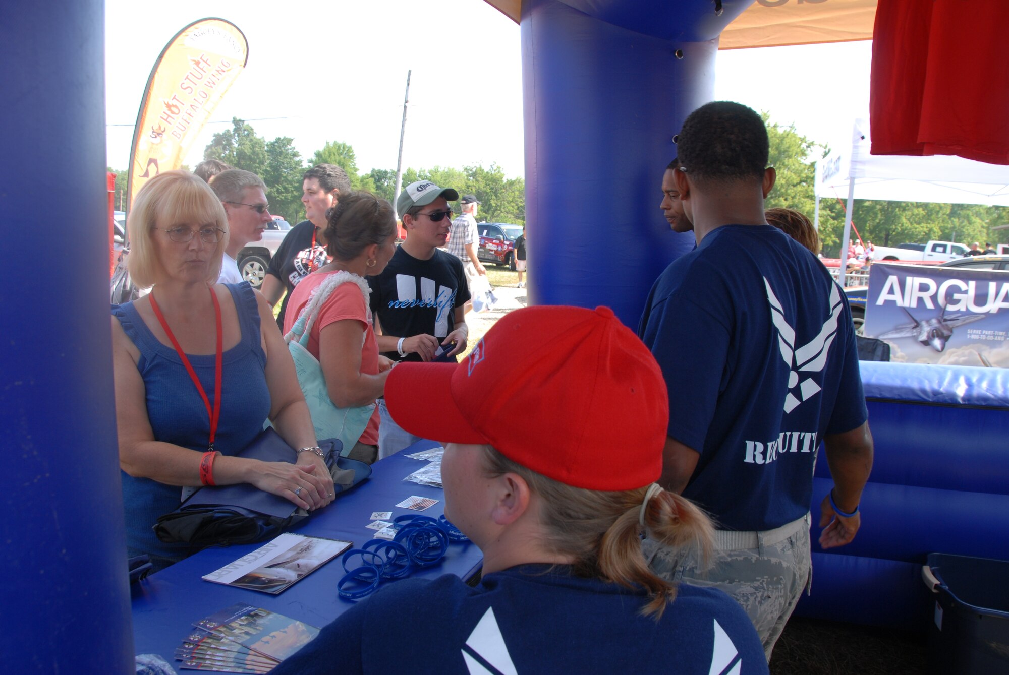LEXINGTON, Ohio -- Recruiters from the 179th Airlift Wing, 178th Fighter Wing and 200th Red Horse Squadron were representing the Ohio Air National Guard August 5 through 7 at the Mid-Ohio Raceway. The recruiters were present to promote the Ohio Air National guard, pass out information to potential recruits and interact with race fans to inform them of all the great things the ANG has to offer. The Air National Guard had their 30-foot mobile recruiting trailer set up, "which incorporates as much about the Ohio ANG units as possible. It's literally a 30-foot billboard and it has gotten us a lot of attention," said Master Sgt. Dana Togliatti, Recruiting office supervisor for the 179th AW. (U.S. Air Force photo by Staff Sgt Robert Koehler/Released)