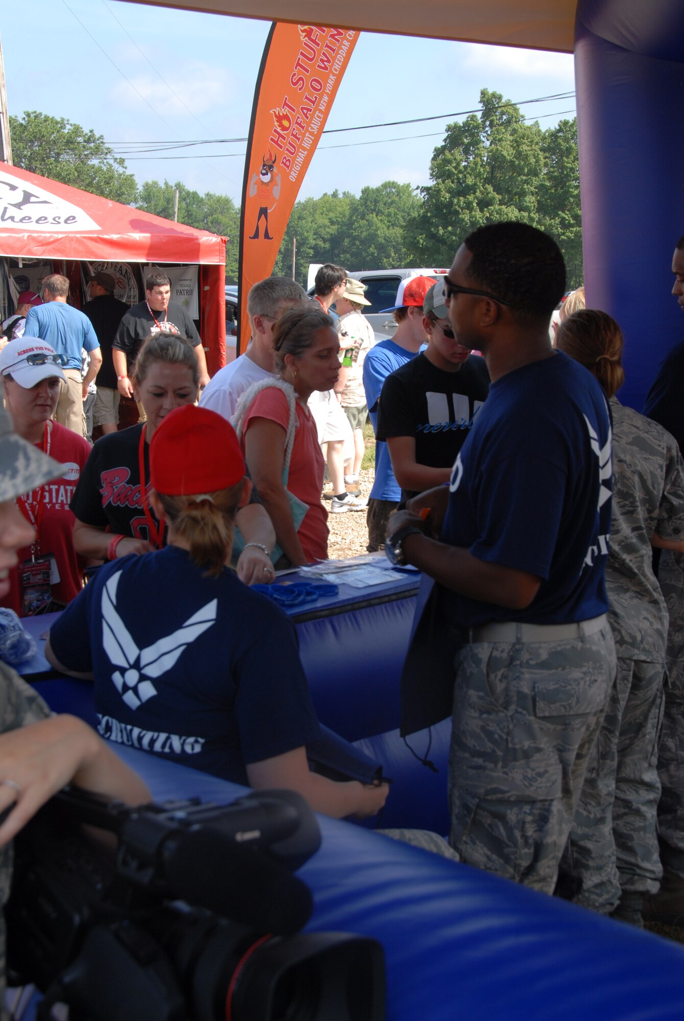 LEXINGTON, Ohio -- Recruiters from the 179th Airlift Wing, 178th Fighter Wing and 200th Red Horse Squadron were representing the Ohio Air National Guard August 5 through 7 at the Mid-Ohio Raceway. The recruiters were present to promote the Ohio Air National guard, pass out information to potential recruits and interact with race fans to inform them of all the great things the ANG has to offer. The Air National Guard had their 30-foot mobile recruiting trailer set up, "which incorporates as much about the Ohio ANG units as possible. It's literally a 30-foot billboard and it has gotten us a lot of attention," said Master Sgt. Dana Togliatti, Recruiting office supervisor for the 179th AW. (U.S. Air Force photo by Staff Sgt Robert Koehler/Released)
