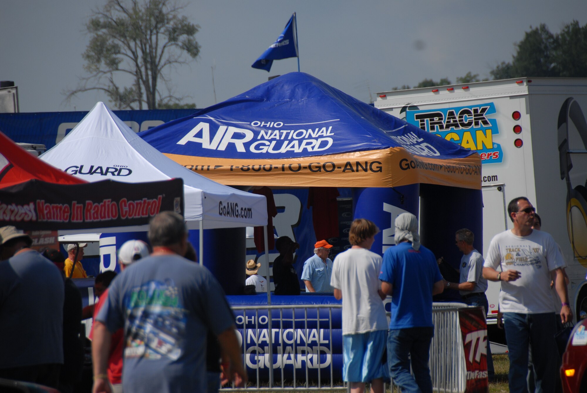 LEXINGTON, Ohio -- Recruiters from the 179th Airlift Wing, 178th Fighter Wing and 200th Red Horse Squadron were representing the Ohio Air National Guard August 5 through 7 at the Mid-Ohio Raceway. The recruiters were present to promote the Ohio Air National guard, pass out information to potential recruits and interact with race fans to inform them of all the great things the ANG has to offer. The Air National Guard had their 30-foot mobile recruiting trailer set up, "which incorporates as much about the Ohio ANG units as possible. It's literally a 30-foot billboard and it has gotten us a lot of attention," said Master Sgt. Dana Togliatti, Recruiting office supervisor for the 179th AW. (U.S. Air Force photo by Staff Sgt Robert Koehler/Released)