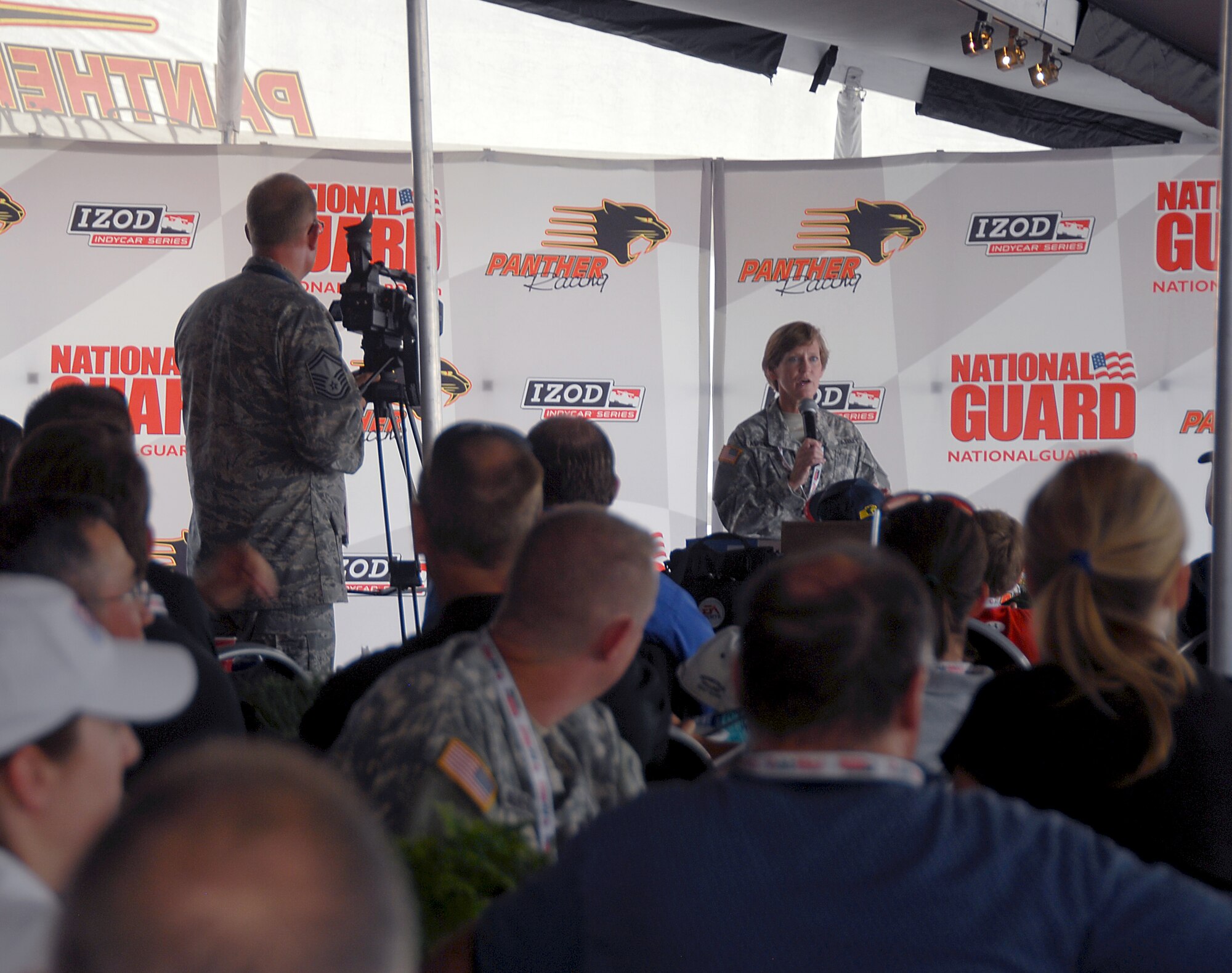LEXINGTON, Ohio -- Recruiters from the 179th Airlift Wing, 178th Fighter Wing and 200th Red Horse Squadron were representing the Ohio Air National Guard August 5 through 7 at the Mid-Ohio Raceway. The recruiters were present to promote the Ohio Air National guard, pass out information to potential recruits and interact with race fans to inform them of all the great things the ANG has to offer. The Air National Guard had their 30-foot mobile recruiting trailer set up, "which incorporates as much about the Ohio ANG units as possible. It's literally a 30-foot billboard and it has gotten us a lot of attention," said Master Sgt. Dana Togliatti, Recruiting office supervisor for the 179th AW. (U.S. Air Force photo by Staff Sgt Robert Koehler/Released)