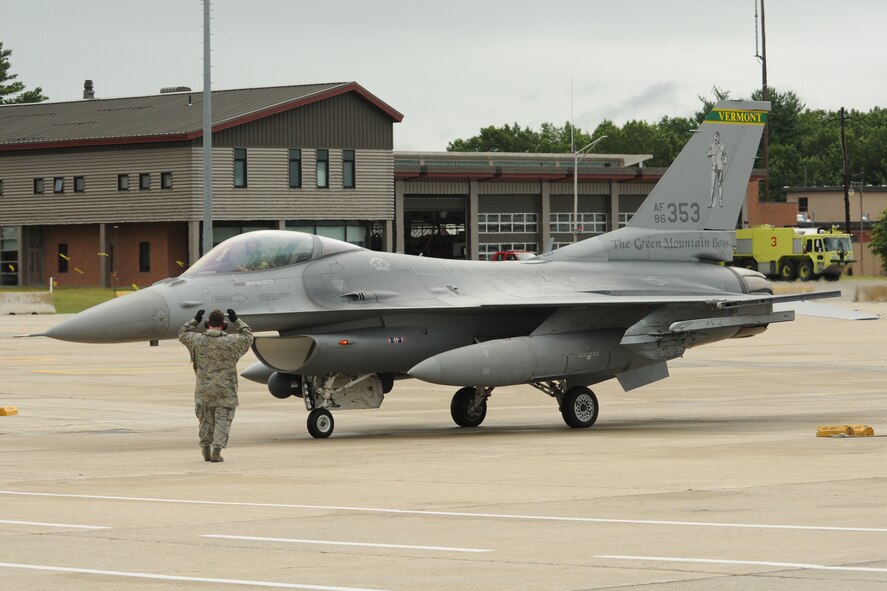 Technical Sergeant Richard J. Reppucci  marshals a transient F-16C Fighting Falcon, Pease Air National Guard Base, New Hampshire, August 16, 2011.  Sergeant Reppucci  is a crew chief assigned to the 157th Aircraft Maintenace Squadron here at Pease.  The F-16 is from the 158th Fighter Wing, Vermont Air National Guard, Burlington, VT.   The aircraft was on static display during the Portsmouth NH Air Show August 13-14. (U.S. Air Force photo/Staff. Sgt. Curtis J. Lenz) (RELEASED)