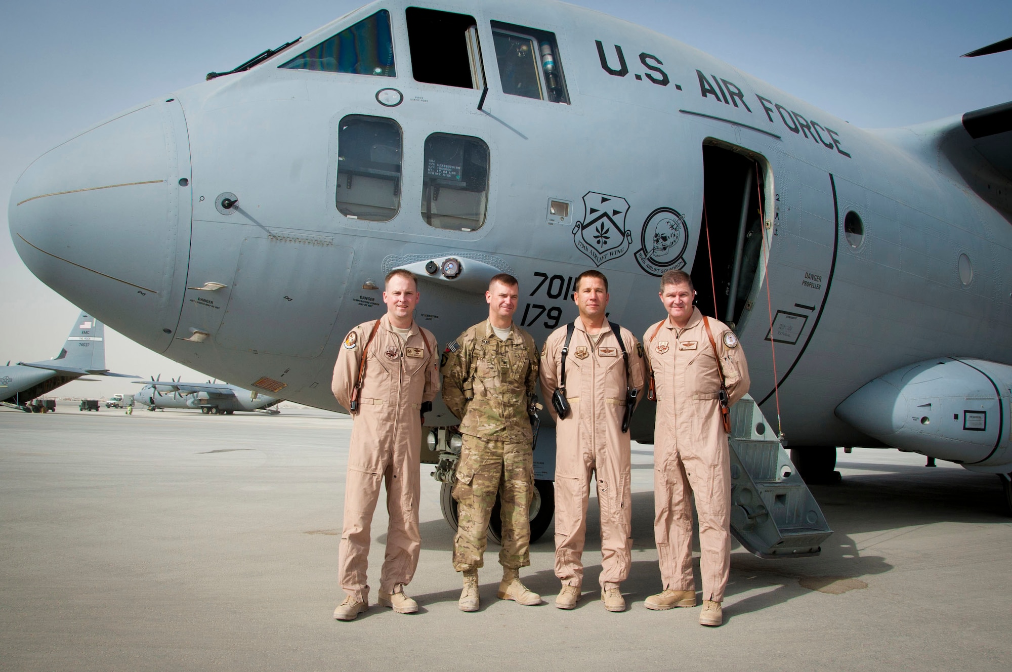 KANDAHAR AIRFIELD, Afghanistan -- Lt. Col. Robert Schuett group shot during the change of command ceremony as he assumes command Aug. 9, 2011. The 702nd EAS is a tactical transport squadron, made up of Army and Air Force Guard flying C-27J Spartans to provide support to Forward Operating Bases. The squadron stood up here July 31. (U.S. Air Force photo by Senior Airman Corey Hook/Released)