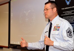 Chief Master Sgt. Kevin Howell, 633rd Air Base Wing command chief, speaks to an NCO professional enhancement class about leadership at Langley Air Force Base Aug. 16, 2011. Howell enlisted in the Air Force in January 1983 as an Aerospace Control and Warning Systems Operator. He has served in a variety of assignments in tactical ground and air operations before taking over as the wing command chief in May.   (U.S. Air Force photo by Staff Sgt. Logan Tuttle/Released)
