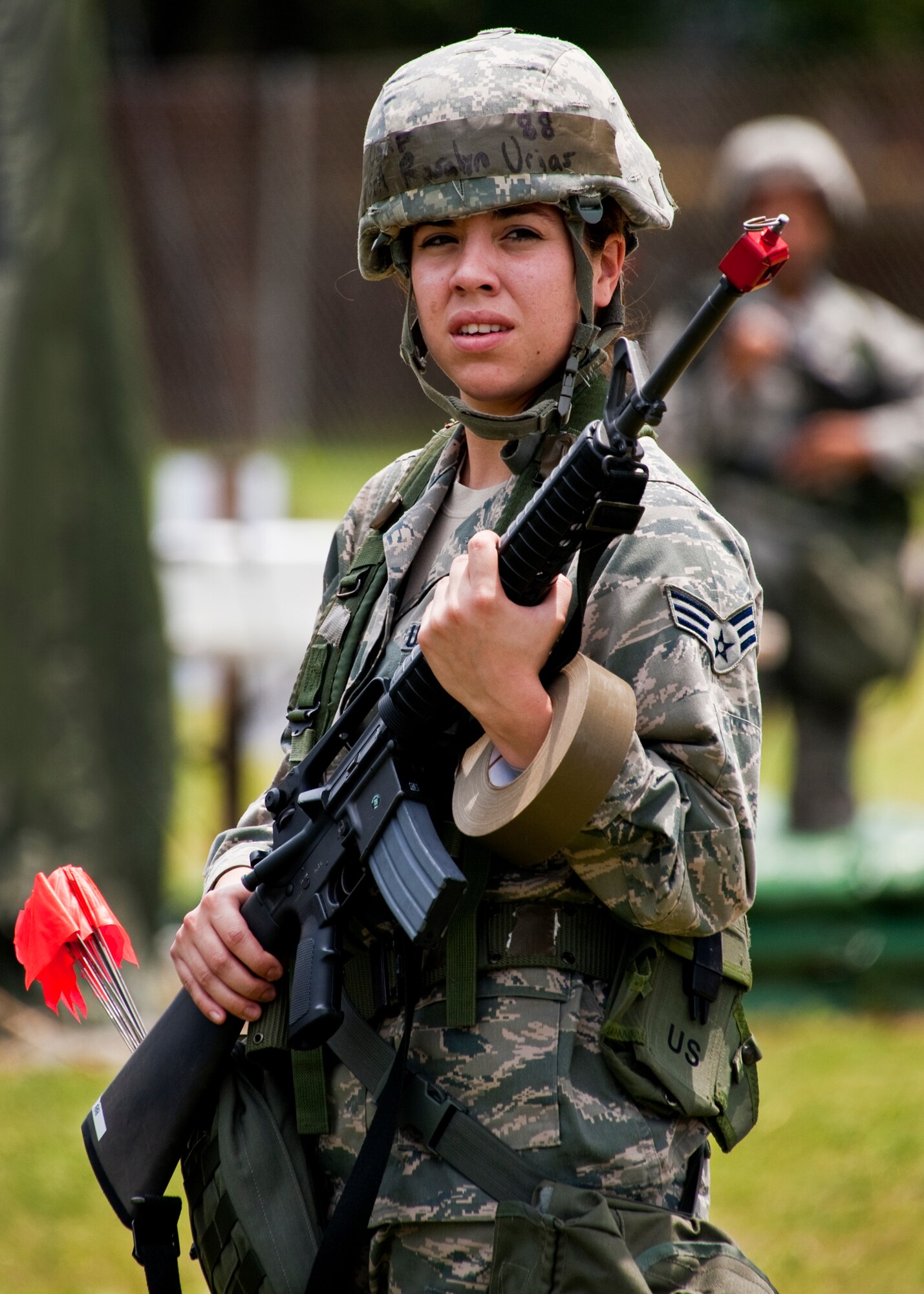 Senior Airman Rosalyn Urias, of the 96th Force Support Squadron, patrols her sector as part of the post attack reconnaissance team during the Phase II exercise Aug. 10 at Eglin Air Force Base, Fla.  More than 100 Airmen braved black flag conditions (and rain) in chemical gear and gas masks to execute self-aid and buddy care, security and chemical attack avoidance missions.  The Phase II was part of a large week-long Operational Readiness Exercise on base.  (U.S. Air Force photo/Samuel King Jr.)