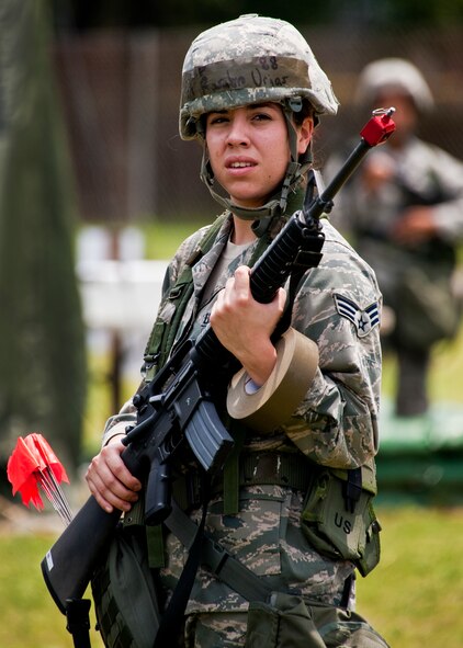 Senior Airman Rosalyn Urias, of the 96th Force Support Squadron, patrols her sector as part of the post attack reconnaissance team during the Phase II exercise Aug. 10 at Eglin Air Force Base, Fla.  More than 100 Airmen braved black flag conditions (and rain) in chemical gear and gas masks to execute self-aid and buddy care, security and chemical attack avoidance missions.  The Phase II was part of a large week-long Operational Readiness Exercise on base.  (U.S. Air Force photo/Samuel King Jr.)