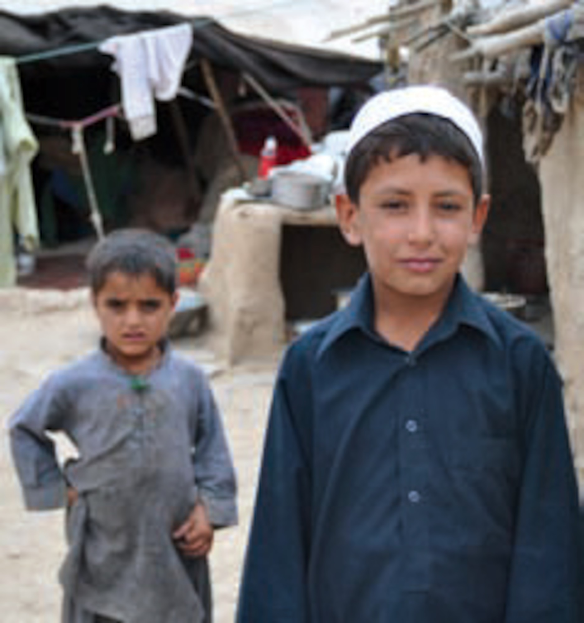 Scenes from an Afghan refugee camp show the poor living conditions residents face. Afghan police visit these camps in an effort to provide hope and assistance to these families, to help and protect these citizens as they try to survive in this war-torn land. (U.S. Air Force photo by Capt Ashley Norris)