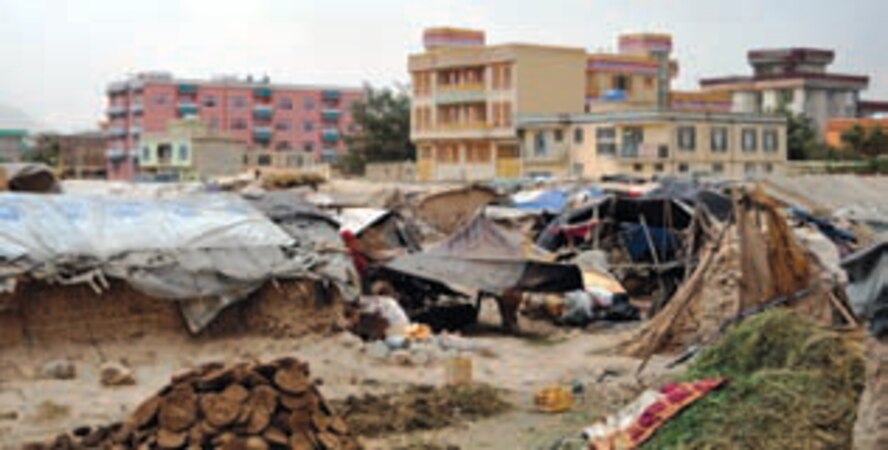 Scenes from an Afghan refugee camp show the poor living conditions residents face. Afghan police visit these camps in an effort to provide hope and assistance to these families, to help and protect these citizens as they try to survive in this war-torn land. (U.S. Air Force photo by Capt Ashley Norris)