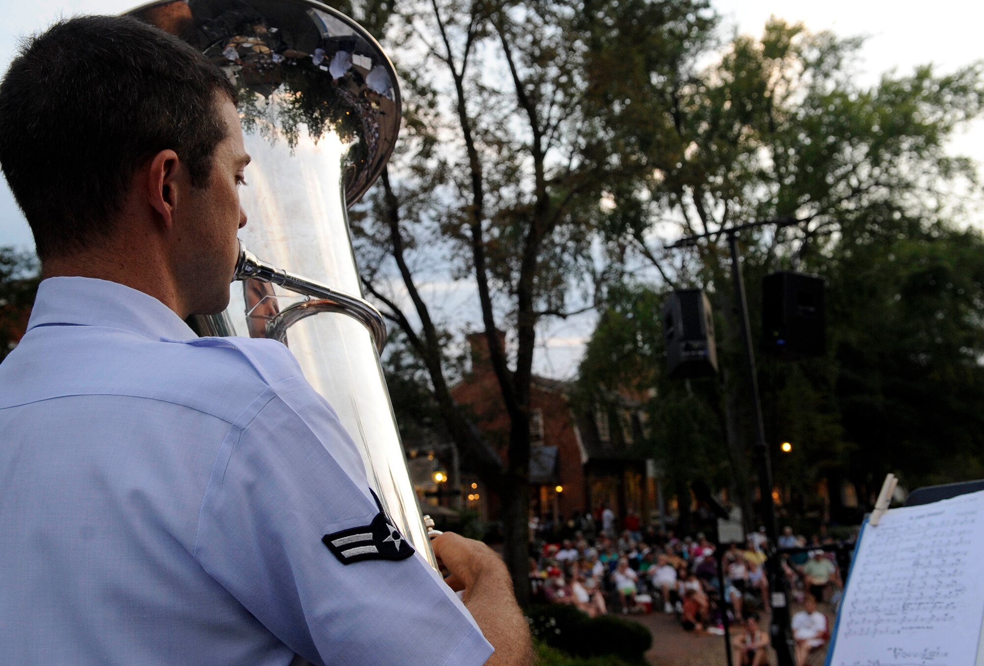 Airman First Class Bud Holmes, Heritage Ramblers tuba player, performs traditional jazz music for audience members during the Summer Breeze concert series Aug. 10, 2011, at Merchant Square in Williamsburg, Va. The Air Force Heritage Ramblers, a part of the Heritage Band of America, are sure to get toes tapping, hands clapping and put smiles on faces wherever they perform.  (U.S. Air Force photo by Staff Sgt. Dana Hill/Released)