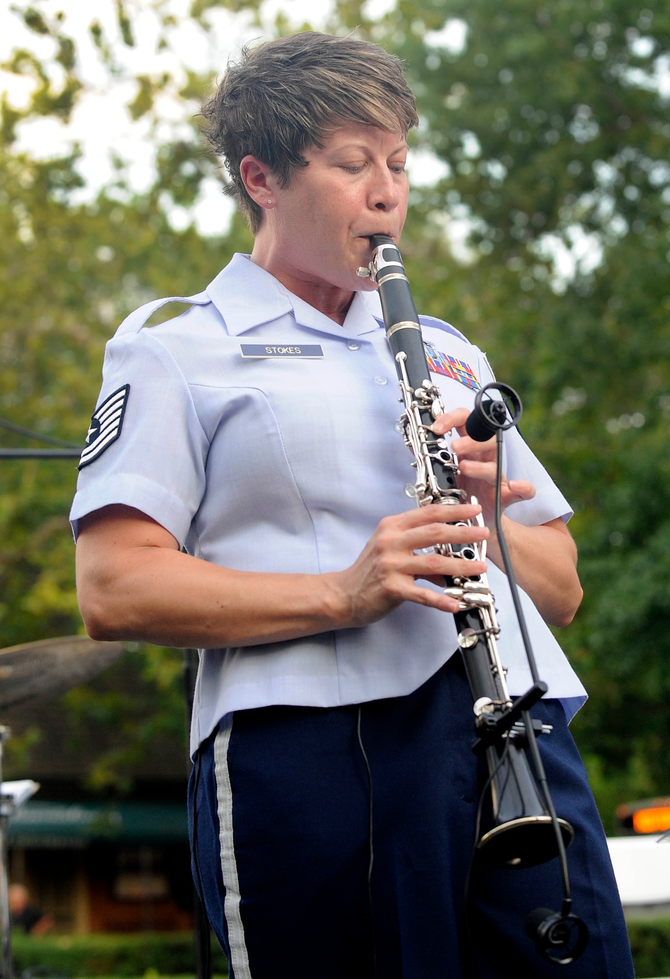 Tech Sgt. Lacey Stokes, Heritage Ramblers flute player, plays a solo for audience members during the Summer Breeze concert series Aug. 10, 2011, at Merchant Square in Williamsburg, Va. The Heritage Ramblers bring the New Orleans and Chicago styles of traditional jazz to life in each performance.  (U.S. Air Force photo by Staff Sgt. Dana Hill/Released)
