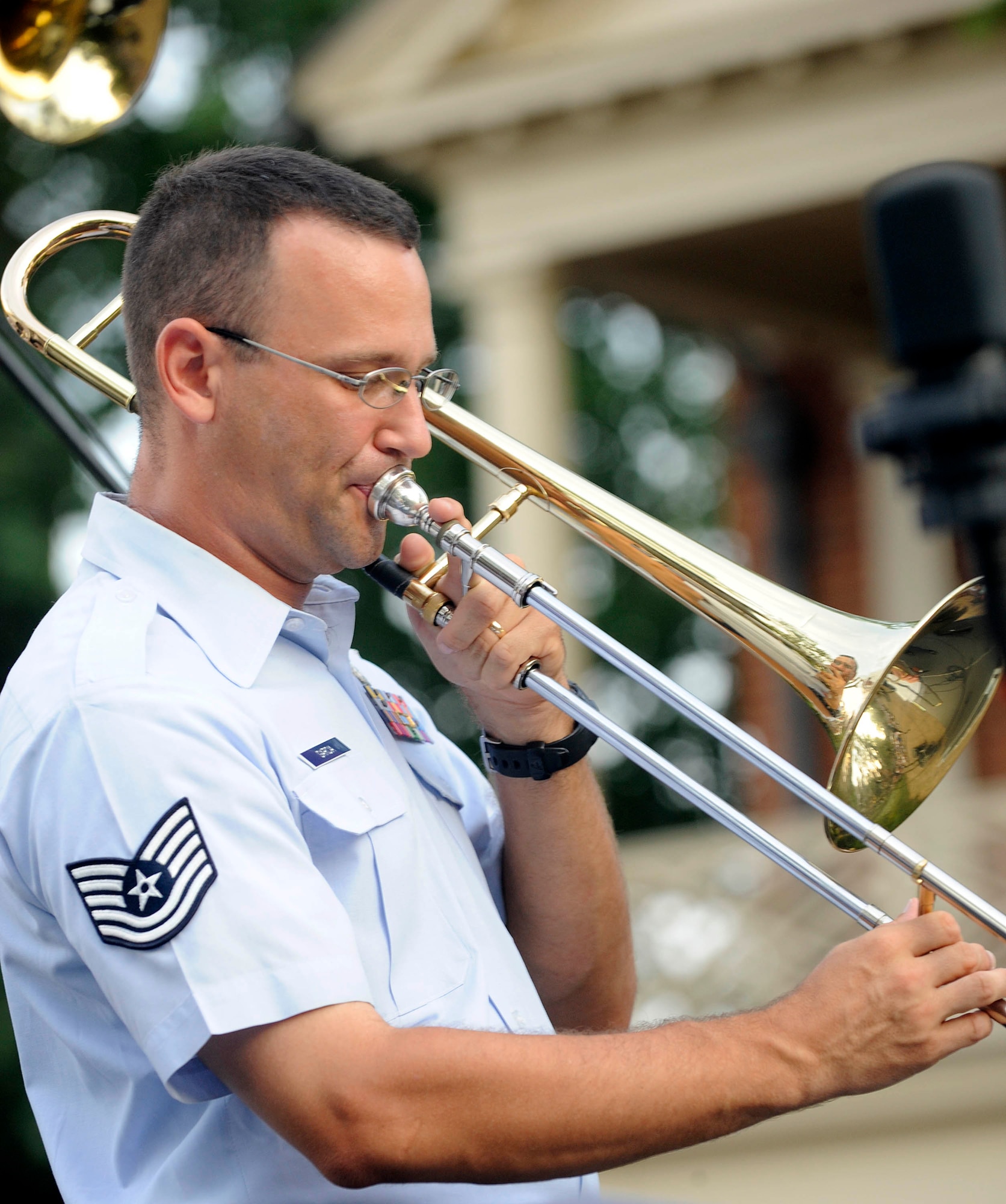 Tech Sgt. John Garcia, Heritage Ramblers euphonium and trombone player, plays a solo for audience members during the Summer Breeze concert series Aug. 10, 2011, at Merchant Square in Williamsburg, Va. The free concert attracted more than 1,000 guests to Merchant Square. (U.S. Air Force photo by Staff Sgt. Dana Hill/Released)