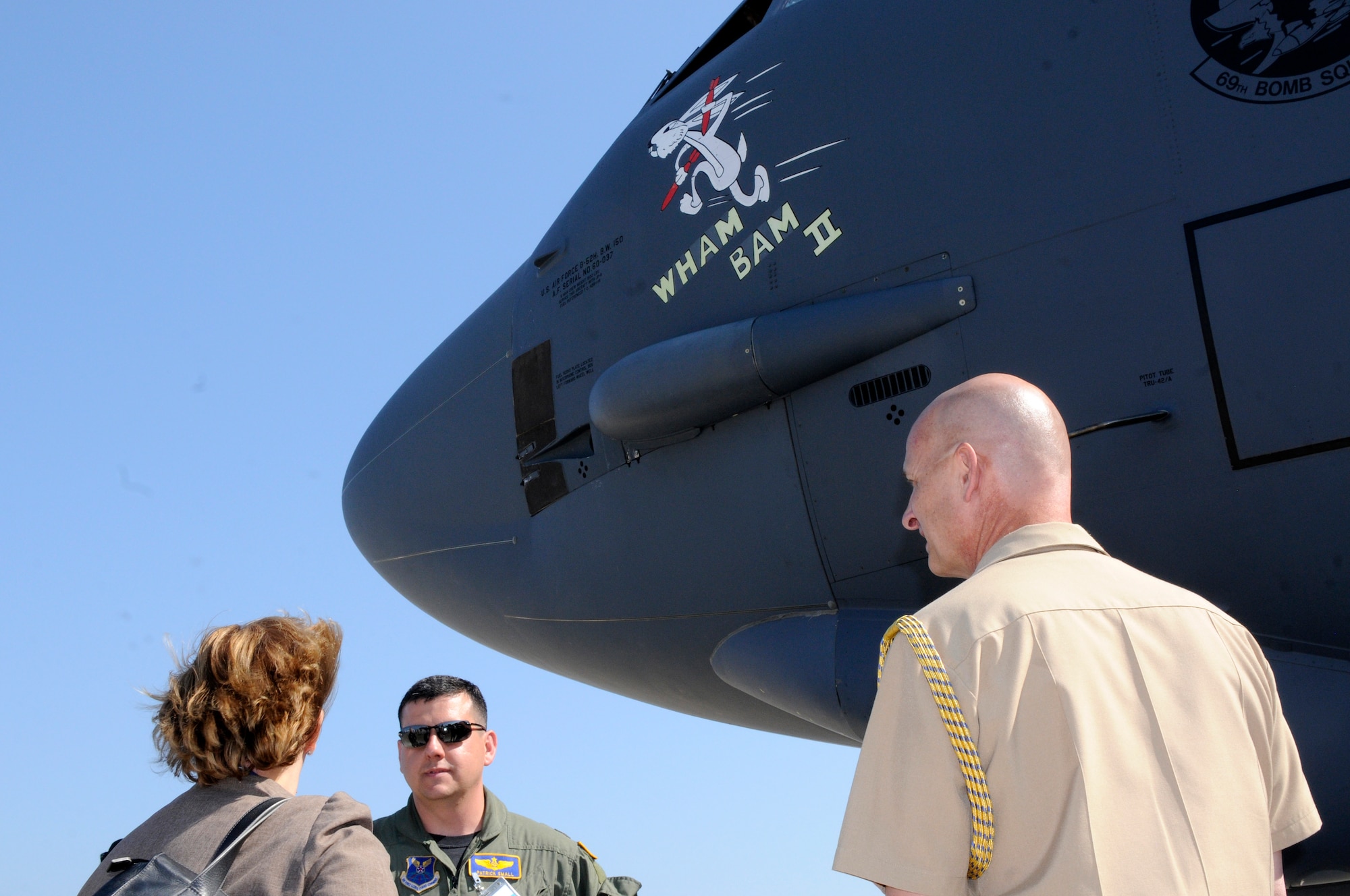 ZHUKOVSKY AIR FIELD, Russia – Capt. Patrick Small, 69th Bomb Squadron navigator from Minot Air Force Base, N.D., greets Ms. Shelia Gwaltney, U.S. Embassy Charge de Affairs, and Rear Adm. Douglas Venlet, U.S. Embassy Defense Attache, before giving them a tour of his B-52 Stratofortress Aug. 16 here for the Moscow International Aviation and Space Salon. MAKS is one of the premier events of its type in the world and Department of Defense participation demonstrates the United States commitment to international security, promotes international cooperation, and contributes to U.S. foreign policy objectives.  The U.S. Air Force has a KC-10 Extender, two F-16C Fighting Falcons, two A-10 Thunderbolt II, one F-15E Strike Eagle, one B-52 Stratotanker, C-130J Super Hercules and C-5M Galaxy statics for the show. (U.S. Air Force photo/Master Sgt. Kelley J. Stewart)