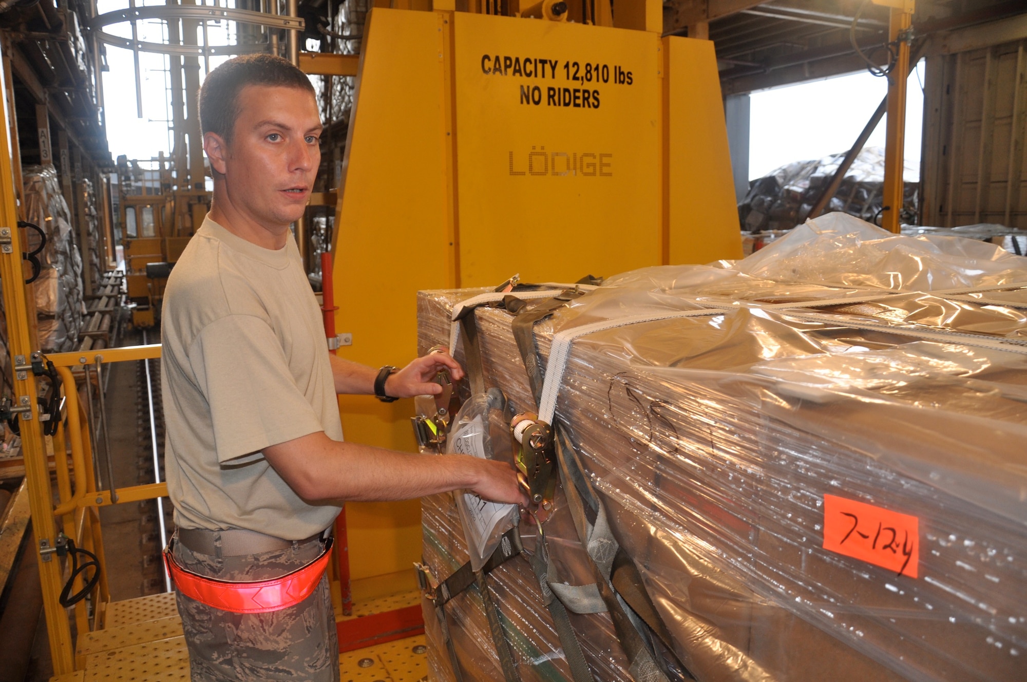 WRIGHT-PATTERSON AIR FORCE BASE, Ohio - Senior Airman Benjamin Singleton, 87th Aerial Port Squadron, affixes a pallet ID to cargo at Joint Base Charleston, S.C., during his annual tour July 14. The unit performed the annual tour July 9 to 23. (U.S. Air Force photo/Tech. Sgt. Jeremy Caskey)