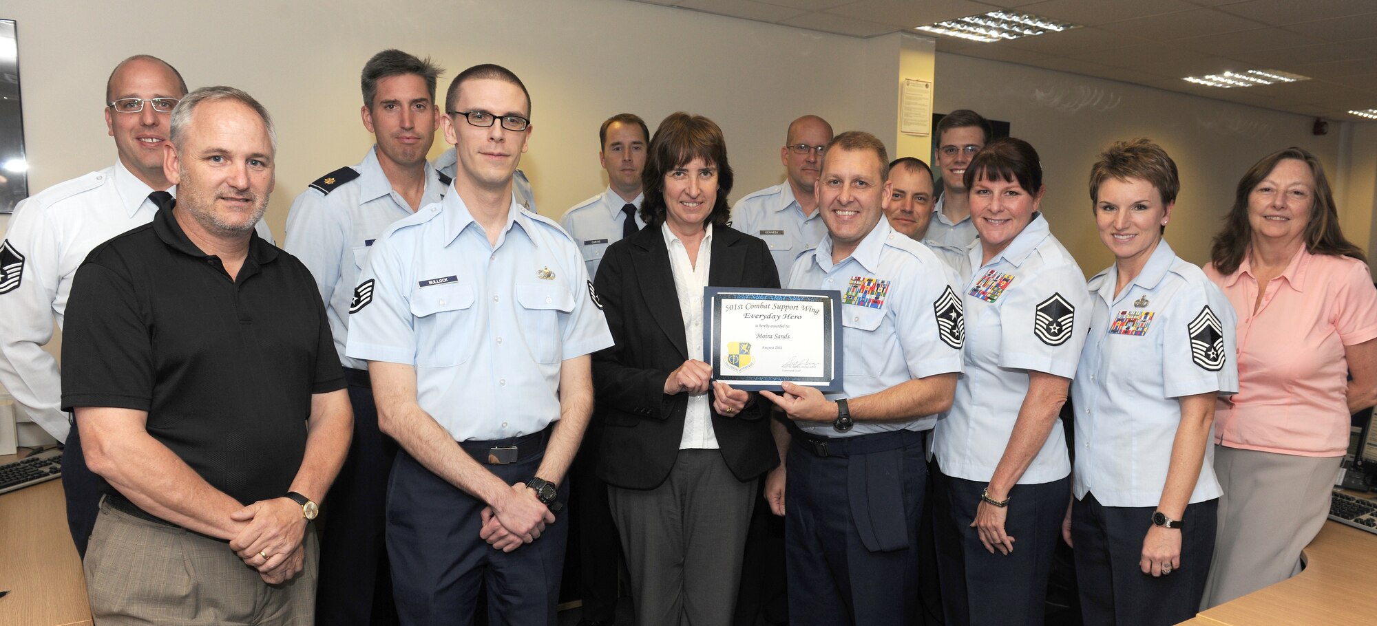 RAF ALCONBURY, United Kingdom - Moira Sands, 501st Combat Support Wing Regional Contracting Office, was named the August 501st Everyday Hero from the 501st CSW Staff. She provides administrative support to the office and is also the alternate system administrator for the Standard Procurement System, which allows $20 million in government contracts to be executed annually. (U.S. Air Force photo by Senior Airman Joel Mease)