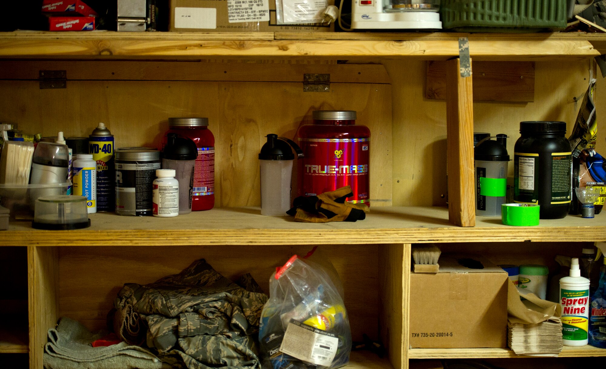 Protein powders and workout supplements fill the middle shelf in the fire house and living quarters at Forward Operating Base Apache in Qalat, Afghanistan.  The firefighters workout everyday in order to stay in shape, and be able to carry out their duties as crash, fire and rescue responders.  (U.S. Air Force photo by Staff Sgt. David Salanitri)