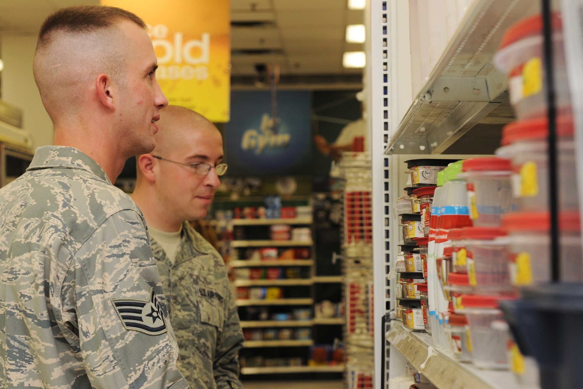 KUNSAN AIR BASE, Republic of Korea – Staff Sgt. Phillip Coley and Staff Sgt. Anthony Maffia, members of the 8th Civil Engineer Squadron, shop at the Base Exchange here Aug. 16. Army, Air Force Exchange Services facilities in Korea are receiving large shipments of merchandise after a software program issue in May. (U.S. Air Force photo/Senior Brittany Y. Bateman)