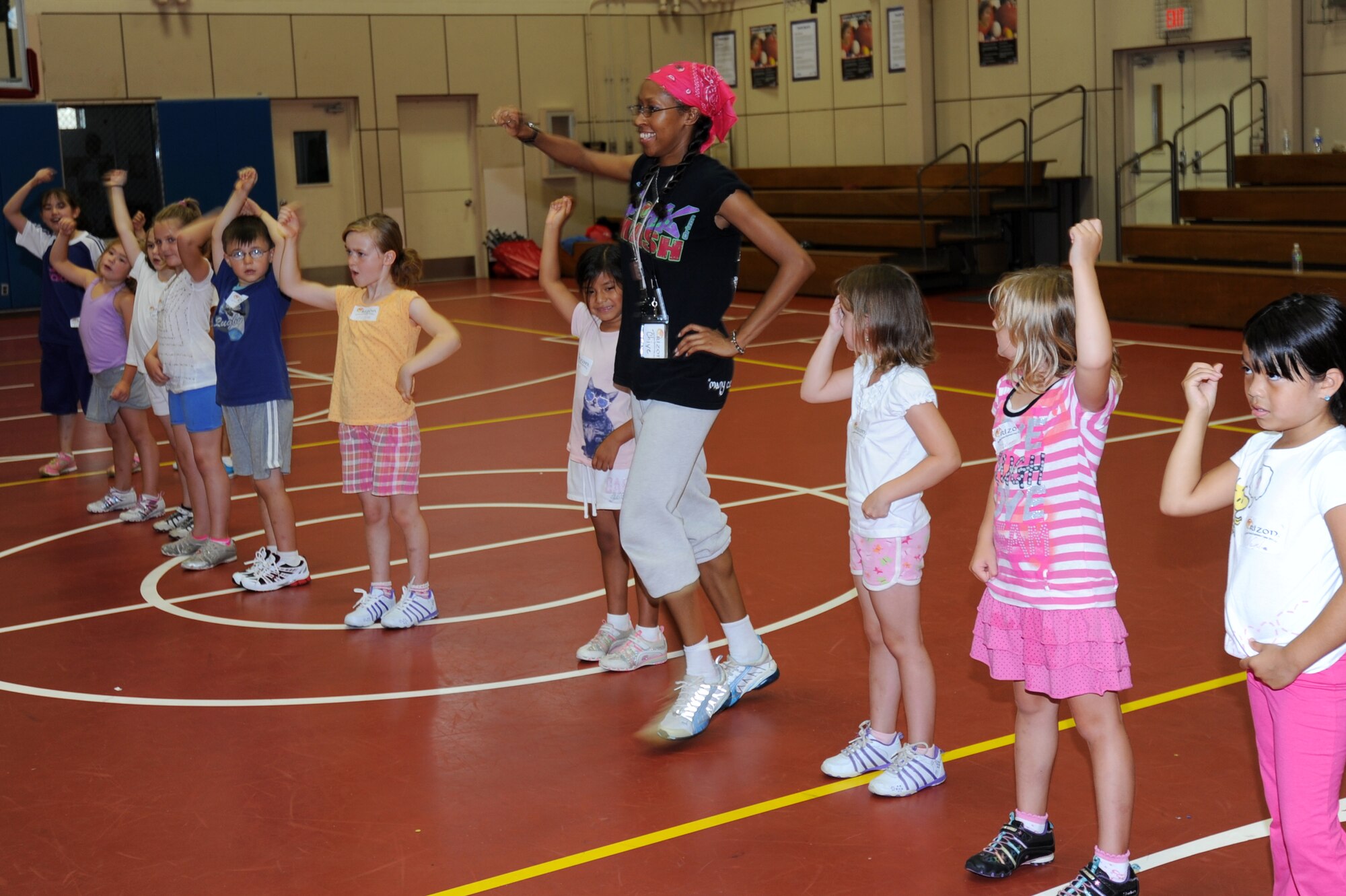 MISAWA AIR BASE, Japan -- Chiye Green, Orizon Soul dance instructor, shows children participating in the Lunney Youth Center's Dance camp how to twirl a lasso Aug 16. The Orizon Soul Program teaches the children of the base different dances in preparation for a performance at the end of the camp.  (U.S. Air Force photo/ Staff Sgt. April Quintanilla)