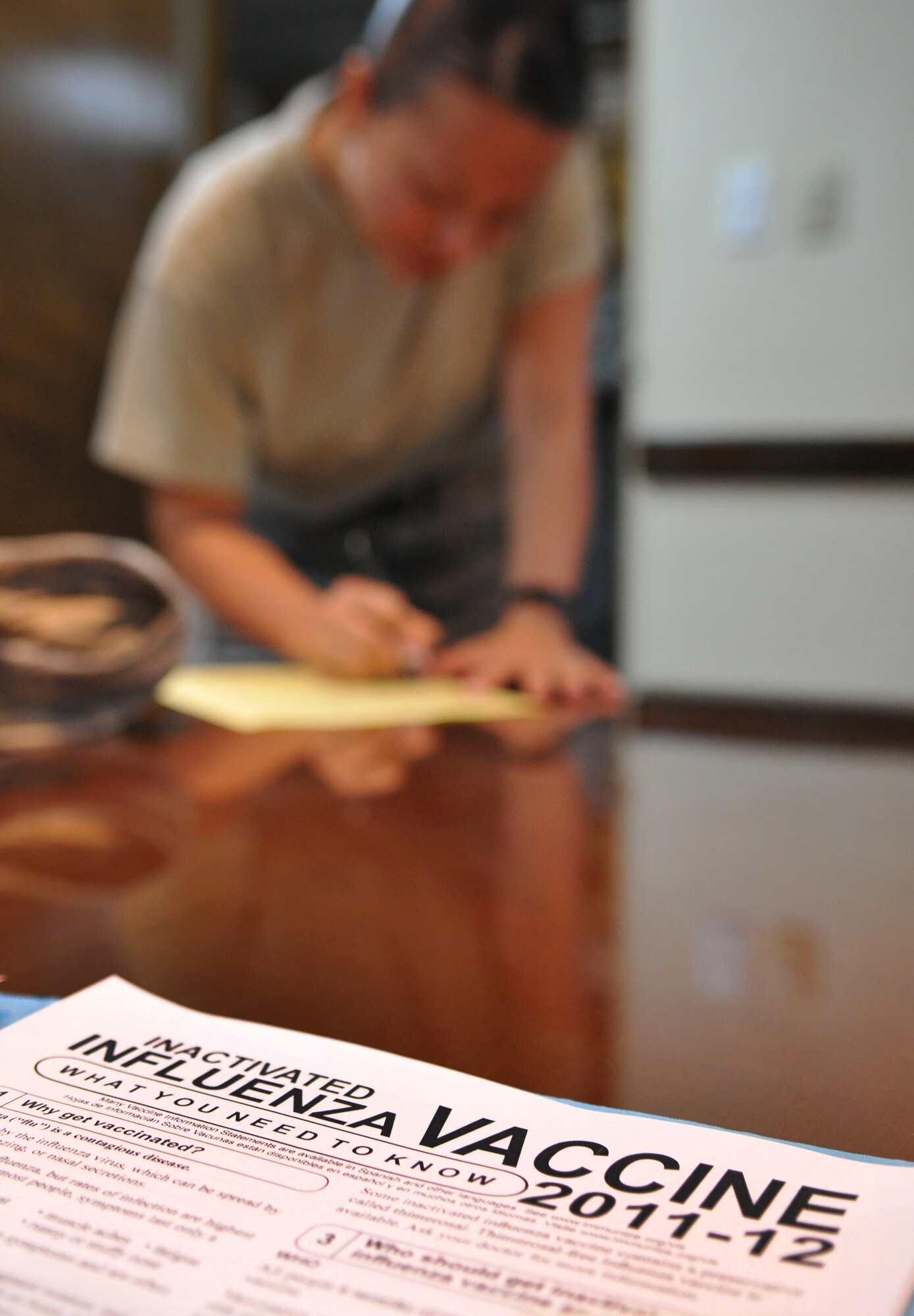 ANDERSEN AIR FORCE BASE, Guam— An Airman from the 36th Command Support Staff signs in before receiving the influenza vaccination here Aug. 16. Andersen personnel can expect a mandatory flu vaccination in the near future as the 36th Wing prepares for the upcoming “flu season” arrives. (U.S. Air Force photo by Senior Airman Benjamin Wiseman/Released)