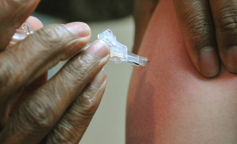ANDERSEN AIR FORCE BASE, Guam— An influenza vaccination is administered to a member of the 36th Command Support Staff here Aug. 16. The flu vaccination will be administered with either the flu shot or intranasal flu mist. (U.S. Air Force photo by Senior Airman Benjamin Wiseman/Released)