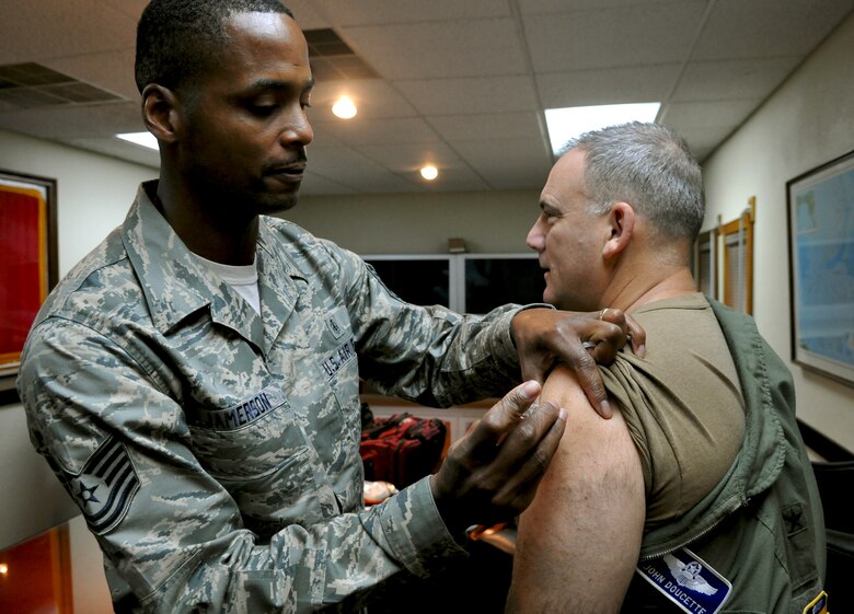 ANDERSEN AIR FORCE BASE, Guam—U.S. Air Force Tech. Sgt. Dannie Jamerson, 36th Medical Group aerospace medical technician, administers a flu shot to Brig. Gen. John Doucette, 36th Wing commander, here Aug. 16. General Doucette received the first flu shot to kick off “flu season” awareness for the rest of the 36th Wing personnel. (U.S. Air Force photo by Senior Airman Benjamin Wiseman/Released)