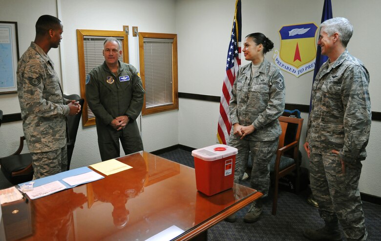 ANDERSEN AIR FORCE BASE, Guam—U.S. Air Force Tech. Sgt. Dannie Jamerson, 36th Medical Group aerospace medical technician, briefs the 36th Wing leadership before administering the influenza vaccination here Aug. 16. With the “flu season” around the corner, Airmen should be prepared to receive mandatory flu vaccinations in the next few weeks. (U.S. Air Force photo by Senior Airman Benjamin Wiseman/Released)