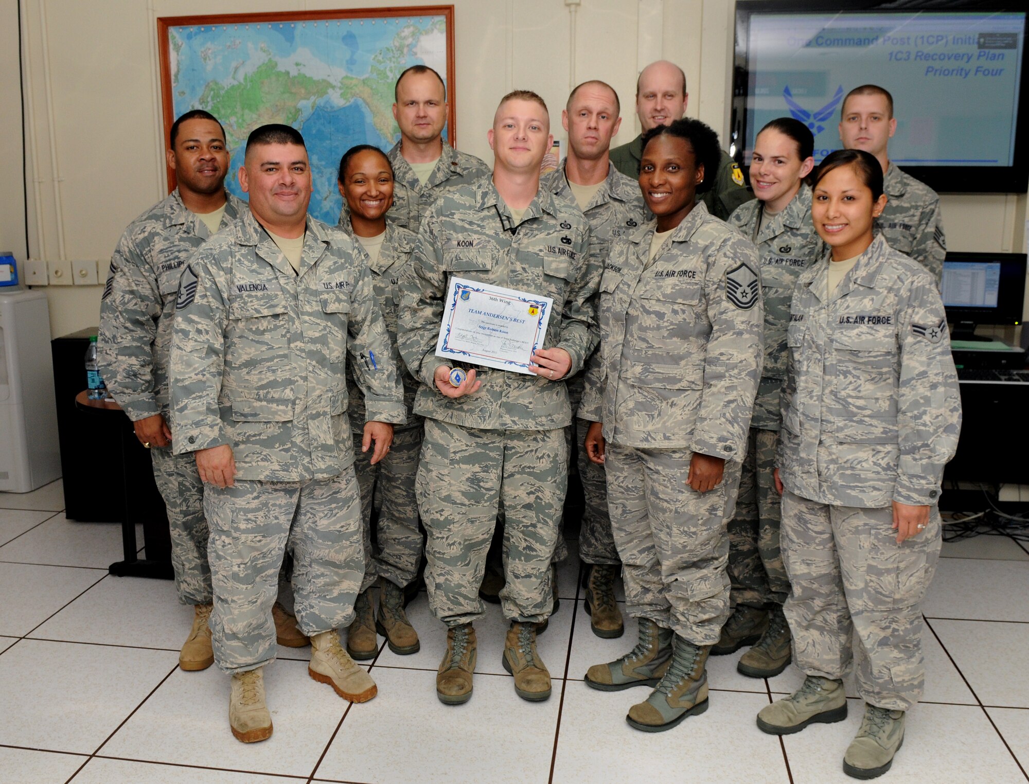 Staff Sgt. Robert Koon, 36th Wing Command Post senior emergency action controller, was awarded Team Andersen's Best here, July 27. Andersen's Best is a recognition program which highlights a top performer from the 36th Wing. Each week, supervisors nominate a member of their team for outstanding performance and the wing commander presents the selected Airman/Civilian with an award. (U.S. Air Force photo by Senior Airman Benjamin Wiseman)