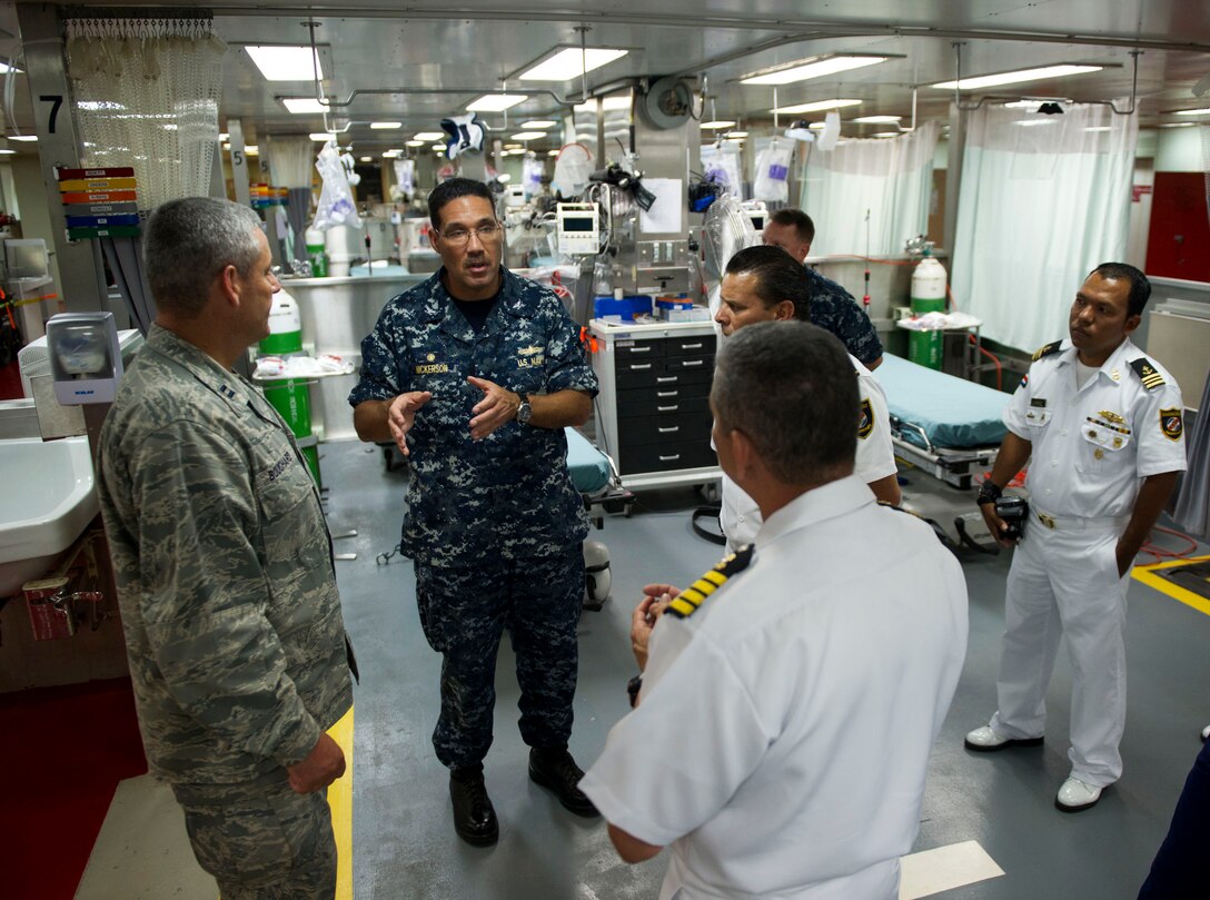 U.S. Navy Commodore Brian Nickerson, mission commander for Continuing Promise 2011, gives Costa Rican Coast Guard officials a tour aboard the Military Sealift Command hospital ship USNS Comfort in Bajo Blay, Costa Rica, Aug. 10, 2011. Continuing Promise is a five-month humanitarian assistance mission to the Caribbean, Central and South America. 
