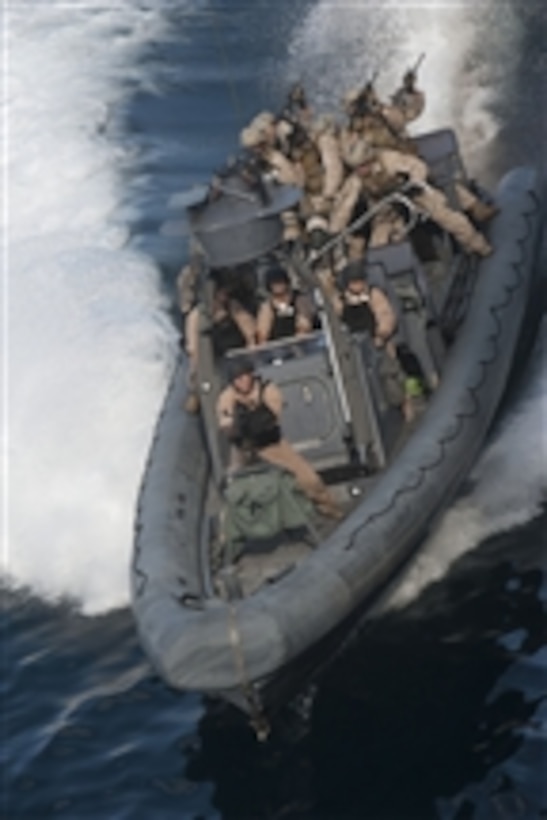 Sailors assigned to the amphibious transport dock ship USS New Orleans (LPD 18) operate a rigid-hull inflatable boat during a practice mission with the 11th Marine Expeditionary Unit Maritime Raid Force while underway in the Pacific Ocean on Aug. 12, 2011.  The New Orleans and embarked Marines are conducting pre-deployment work-ups as part of the Makin Island Amphibious Ready Group.  