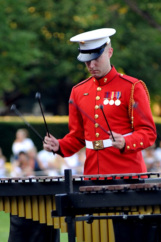 Sgt. Christopher R. Garcia, embarkation specialist, logistics section, 15th Marine Expeditionary Unit, explains weapons capabilities to a group of cadets with El Camino High School's Junior Reserve Officer Training Corps at the MEU's armory in Camp Del Mar, Aug. 16. Marines and sailors of the MEU educated a portion of the school's JROTC where they spent two days on base living like Marines to better their understanding of the operational side of the Marine Corps. Garcia, 24, is a native of Denver.