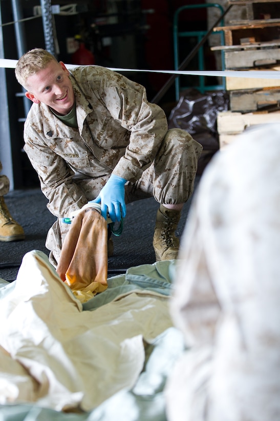 Sgt. Robert Brown fills helium into a communications balloon aboard the amphibious assault ship Makin Island off Southern California’s coast Aug. 16. The balloon is designed to carry a radio-relay system up to 80,000 feet above Earth, extending communications to an area 600 miles in diameter, regardless of terrain. Brown, a 27-year-old Joliet, Ill., native, serves as assistant radio chief for the 11th Marine Expeditionary Unit’s command element. A balloon launch from sea Aug. 16 signaled the unit’s and the ship’s first of a device of its kind.