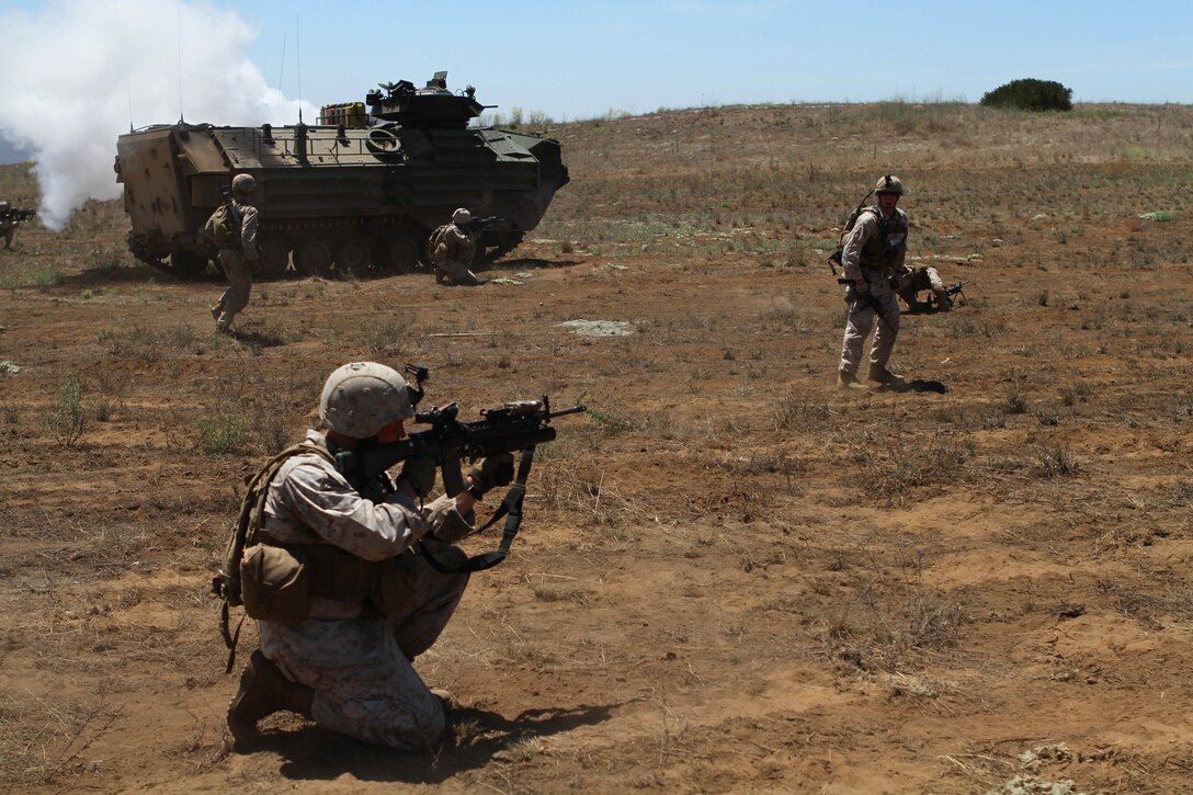 Company L Marines rehearse capturing an enemy position Aug. 16 during live-fire training here. The rifle company is one of three in Battalion Landing Team 3/1, the ground combat element for the 11th Marine Expeditionary Unit. Company L spent five days in the field during the unit’s first sea-based training since becoming a complete Marine air ground task force in May. The company disembarked USS New Orleans off Pendleton’s coast and was driven ashore by amphibious assault vehicles. A platoon of tracked vehicles from 3rd Assault Amphibian Battalion, Camp Pendleton, reinforces the Pendleton-based 3rd Battalion, 1st Marines. The platoon provides the go-to means of maneuver for Company L.