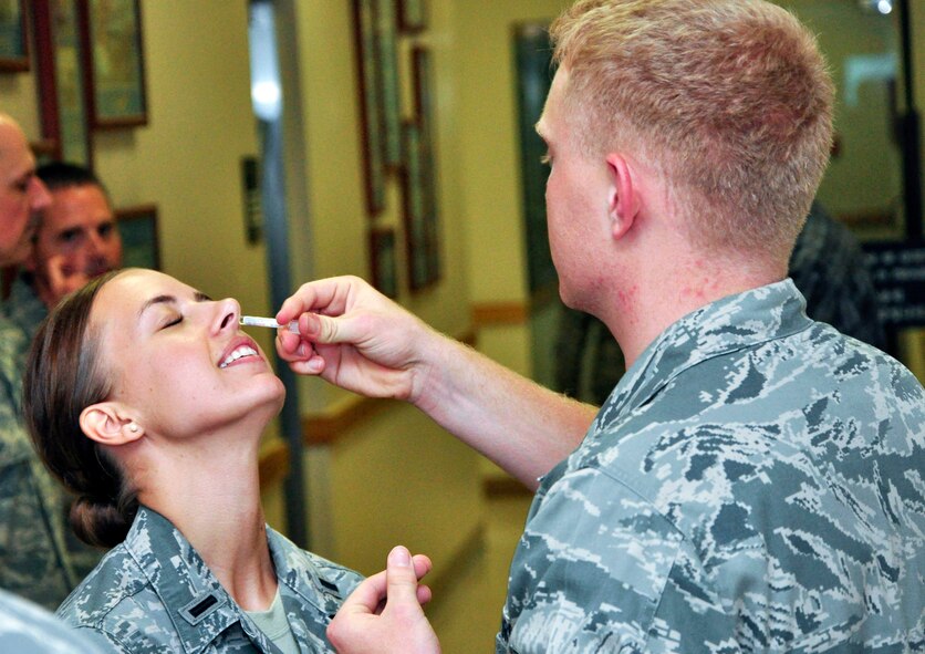 1st Lt. Sara Greco, 51st Fighter Wing public affairs, recieves her yearly flu vaccination Aug. 16, 2011 at Osan Air Base, Republic of Korea. The 2011 vaccination is now available for all active-duty military members. The medical group will be making rounds through each squadron, but the shots are also available Monday through Friday from 7 a.m. to 5 p.m. at the base immunization clinic. Information will be released once the clinic recives more vaccinations for family members and civilian employees. (U.S. Air Force photo/Tech. Sgt. Chad Thompson)