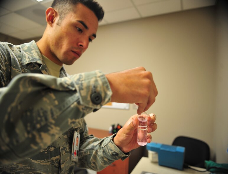 Airman 1st Class Francisco Sanchez, 92nd AMDS Bioenvironmental technician, analyzses a base water sample at the 92nd Medical Group Bioenvironmental lab. The Bioenvironmental flight analyzes occupational and community environments and processes to determine whether toxic chemicals, ionizing and non-ionizing radiation sources, shock and vibration, acoustic energy and ergonomic stresses are adequately controlled. 