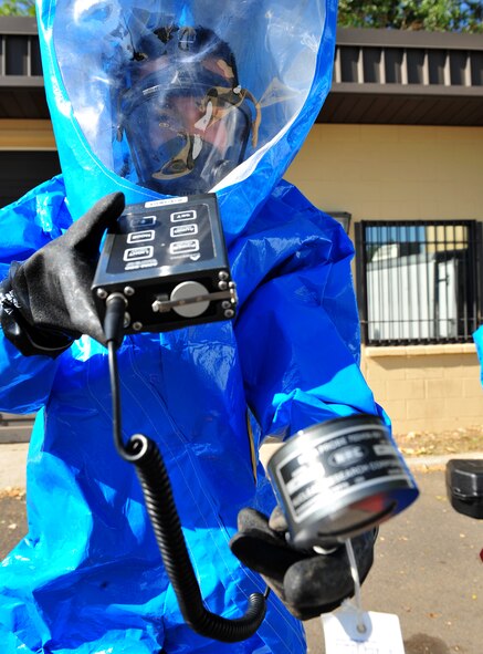 Airman 1st Class Francisco Sanchez, 92nd Aerospace Medicine Squadron Bioenvironmental technician, wears a Level-A suit and uses an ADM 300 beta probe to verify if beta radiation is present Aug 11. The Bioenvironmental flight participates in emergency response activities and medical aspects of safety and accident programs by providing environmental health hazard evaluations and personnel protective equipment recommendations.  (U.S. Air Force photo/Staff Sgt. Michael Means)