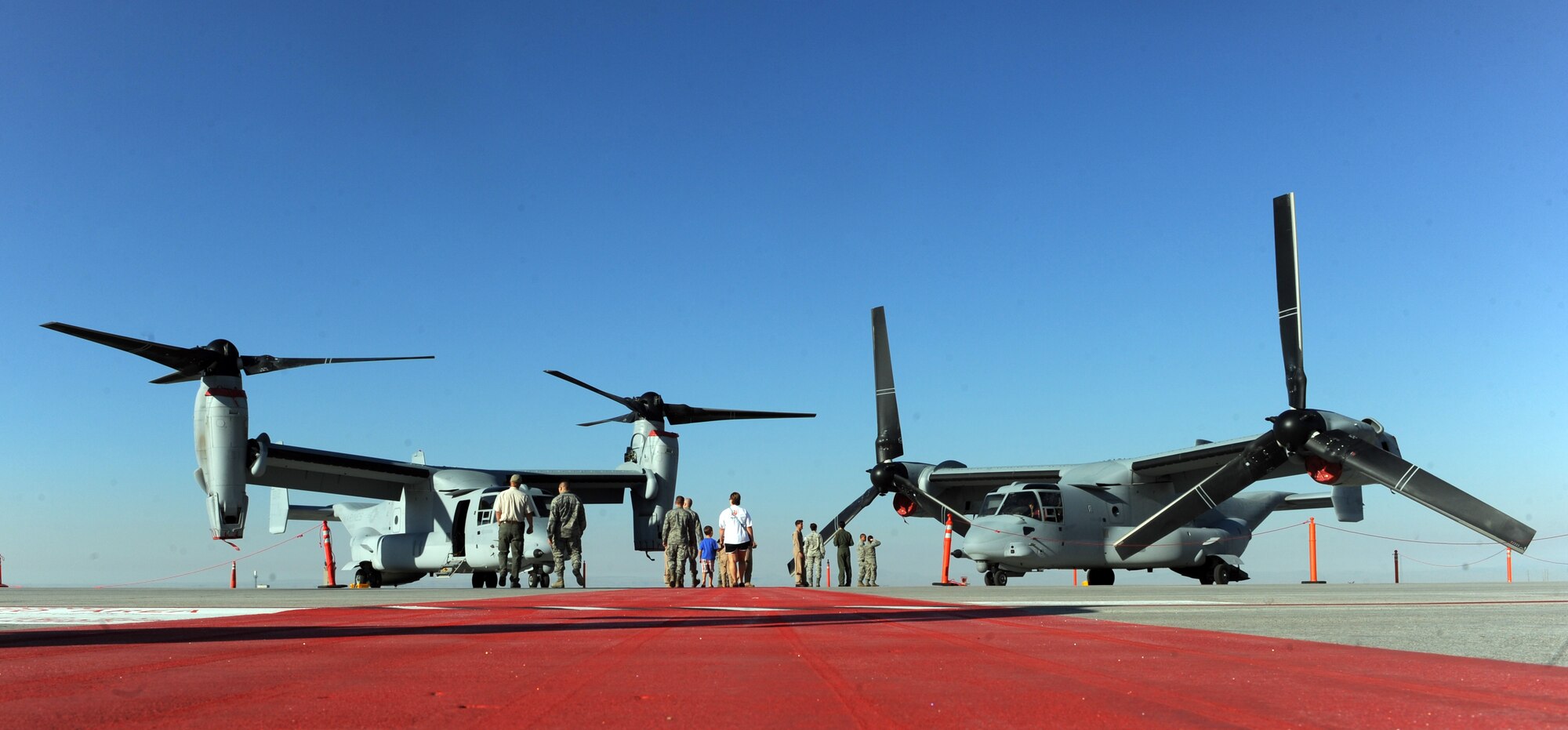 Gunfighters and their families tour a static display of two MV-22 Osprey aircraft assigned to Marine Medium Tiltrotor Squadron 166 out of Marine Corps Air Station Miramar, Calif., at Mountain Home Air Force Base, Idaho, Aug. 17, 2011. Approximately 180 Marines from VMM-166 will be conducting training at MHAFB from Aug. 9th to the 25th. (U.S. Air Force photo by Senior Airman Debbie Lockhart)