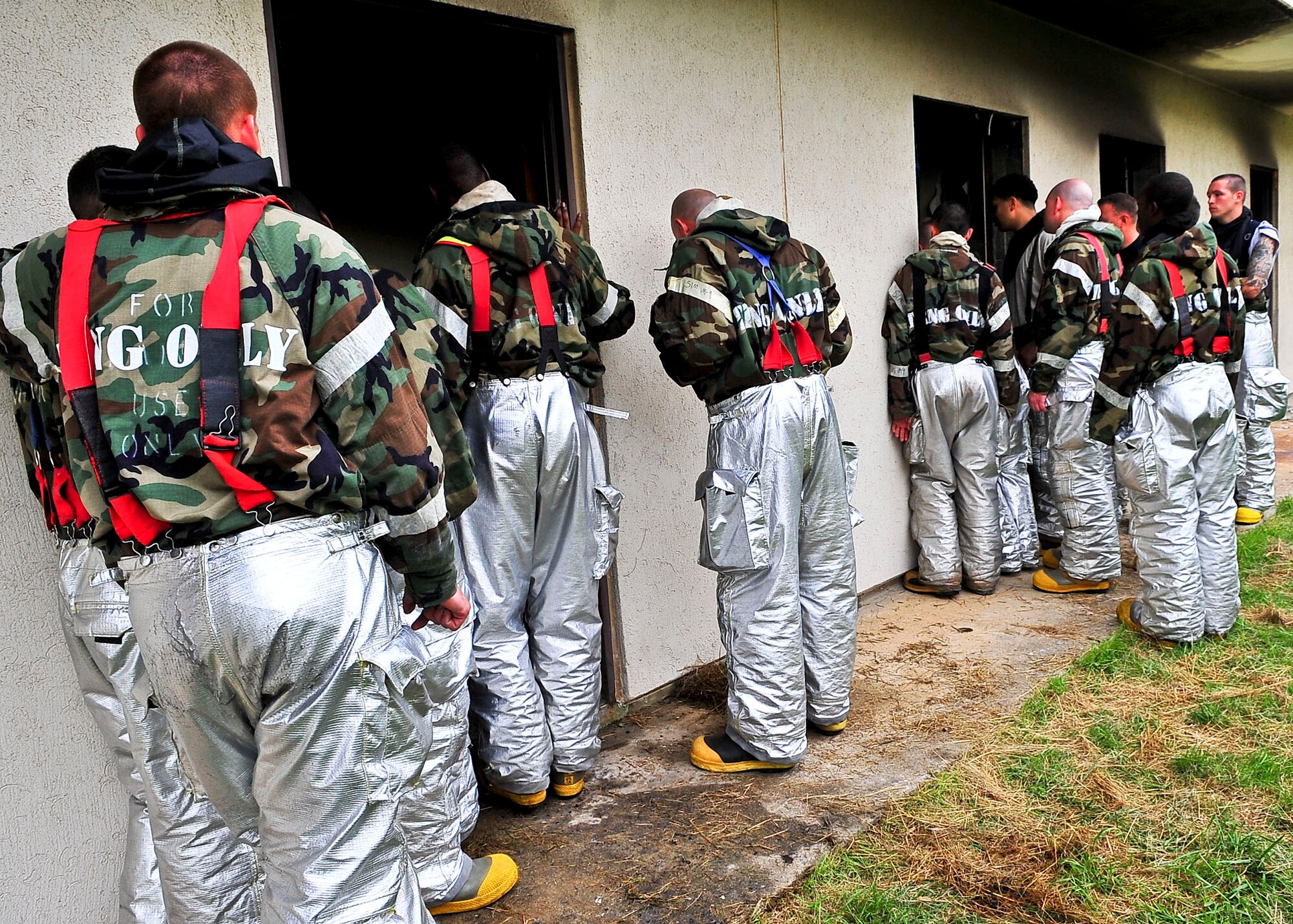 Members of the 51st Fighter Wing Civil Engineer Squadron, await a training brief before participating in Silver Flag a two week long exercise held to sharpen contingency training, Aug. 16. During the training   members were trained on JS-List Structural Fire Fighting which is a requirement of all bases with in the Pacific Forces. (U.S. Air Force Photo by/ Senior Airman Adam Grant)