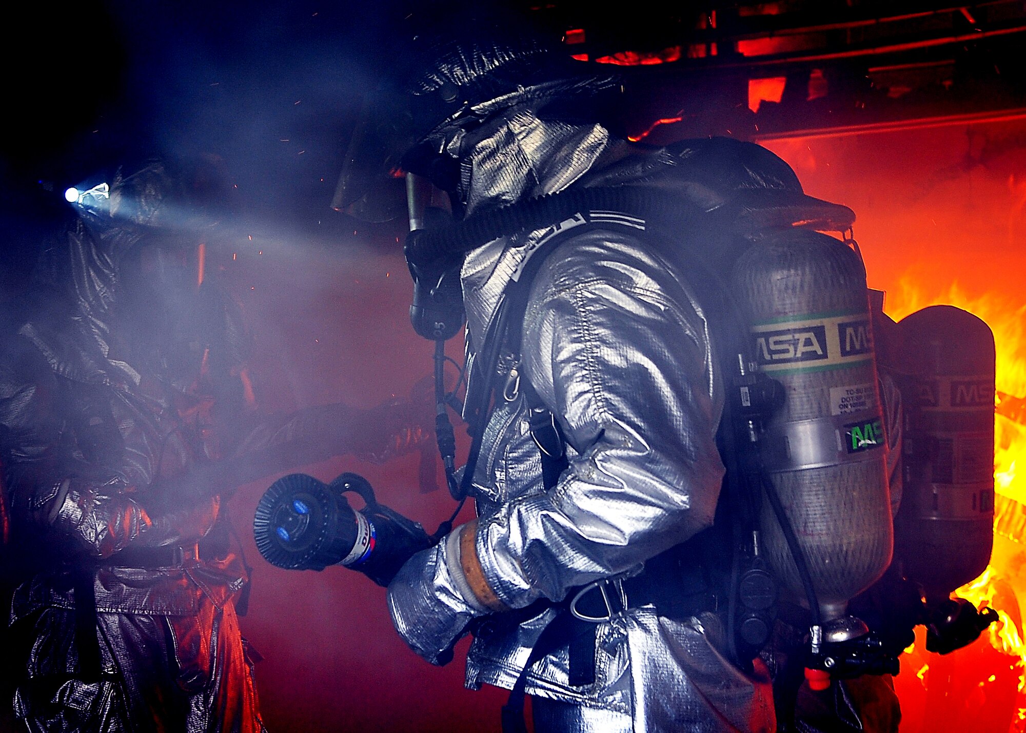 Airmen from the 51st Civil Engineer Squadron, examine the aftermath of a Js-List structural fire during Silver Flag, Aug. 16. Once all fires are extinguished the Airmen will then proceed to search for any signs of victims that need to be evacuated. (U.S. Air Force photo/Staff Sgt. Daylena Gonzalez)
 
