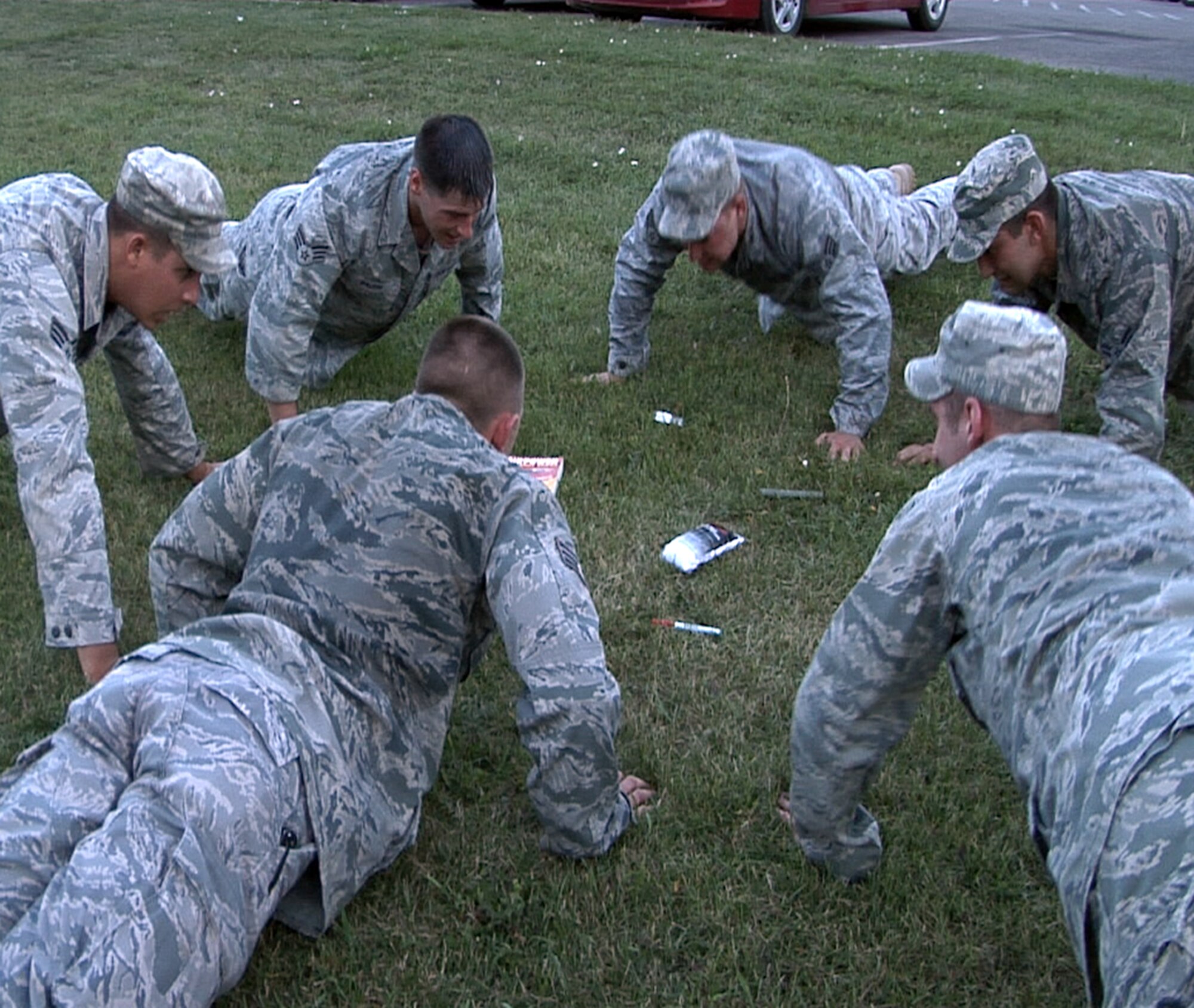 MINOT AIR FORCE BASE, N.D. -- Security forces Airmen from the 5th Bomb Wing here complete push ups as part of the security forces tryouts, here Aug. 16. 5th Security Forces Squadron Airmen competed for a chance to represent the wing for the upcoming Global Strike Challenge, which is an Air Force Global Strike Command competition for Air Force ICBM and bomber forces. (U.S. Air Force photo by Tech. Sgt. Mark Bell) (RELEASED)