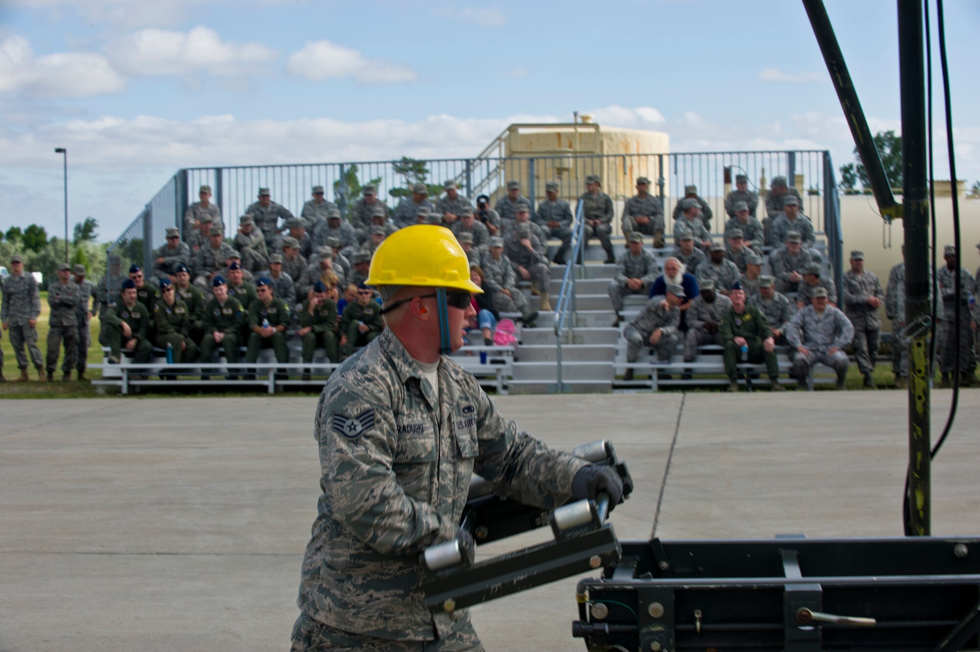 MINOT AIR FORCE BASE, N.D. -- Staff Sgt. Casey Raduski, 5th Munitions Squadron maintenance crew members, help to assemble unguided conventional bombs during a practice run for the second annual Air Force Global Strike Command Global Strike Challenge here, Aug. 16. Minot Airmen from both the 5th Bomb Wing and the 91st Missile Wing participate in this year's AFGSC Global Strike Challenge during the months of June through November to showcase the world's premier bomber and ICBM force and to recognize outstanding AFGSC personnel and teams. (U.S Air Force photo by Senior Airman Aaron-Forrest Wainwright) (RELEASED)