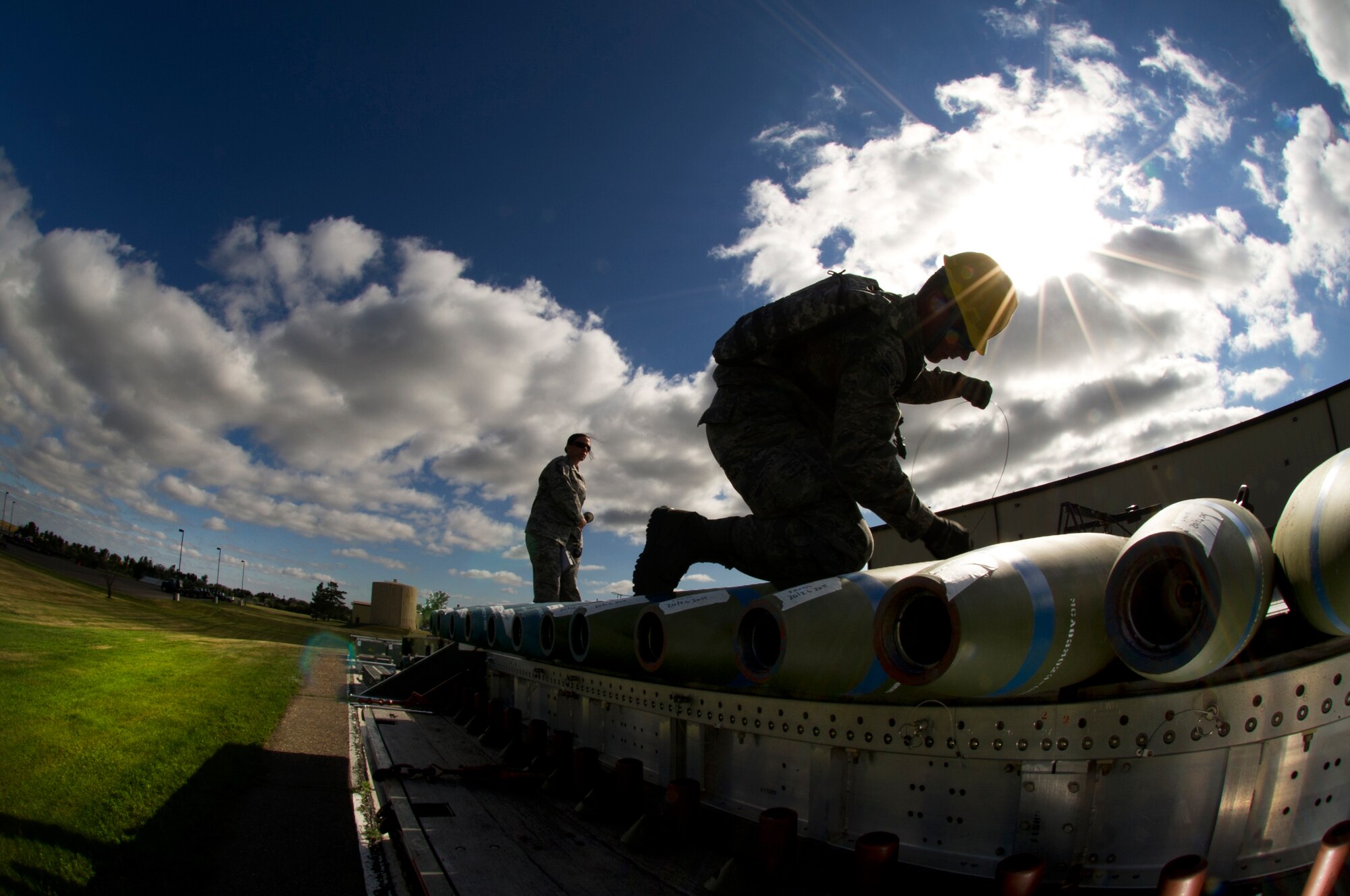MINOT AIR FORCE BASE, N.D. -- Airman 1st Class Jason Vanover, 5th Munitions Squadron maintenance crew member, helps to assemble unguided conventional bombs during a practice run for the second annual Air Force Global Strike Command Global Strike Challenge here, Aug. 16. Minot Airmen from both the 5th Bomb Wing and the 91st Missile Wing participate in this year's AFGSC Global Strike Challenge during the months of June through November to showcase the world's premier bomber and ICBM force and to recognize outstanding AFGSC personnel and teams. (U.S Air Force photo by Senior Airman Aaron-Forrest Wainwright) (RELEASED)