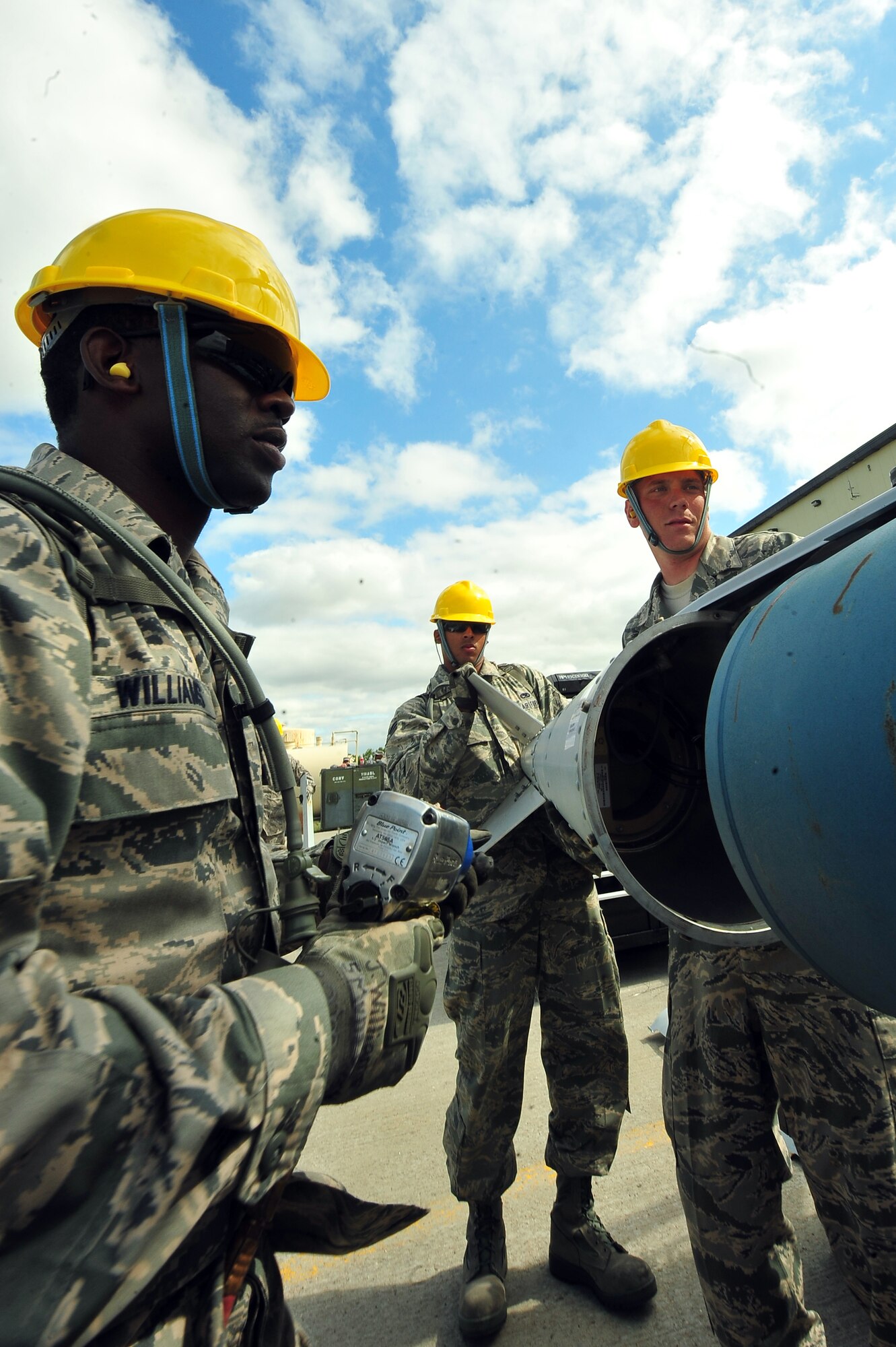 MINOT AIR FORCE BASE, N.D. – 5th Munitions Squadron maintenance crew members, help assemble unguided conventional bombs during the second annual Air Force Global Strike Command Global Strike Challenge here, Aug. 16. Minot Airmen from both the 5th Bomb Wing and the 91st Missile Wing participate in this year's AFGSC Global Strike Challenge during the months of June through November to showcase the world's premier bomber and ICBM force and to recognize outstanding AFGSC personnel and teams. (U.S Air Force photo by Senior Airman Jesse Lopez) (RELEASED)