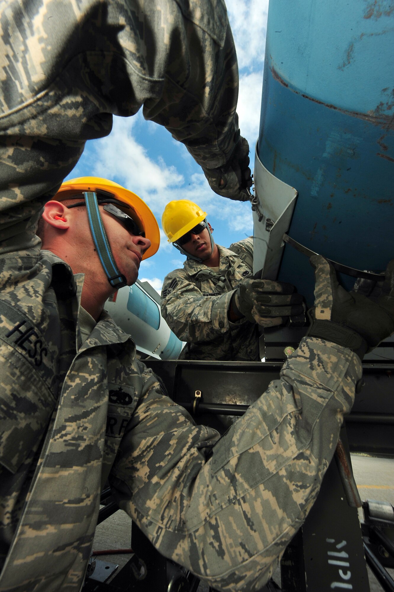 MINOT AIR FORCE BASE, N.D. – Senior Airman Dennis Barnett and Staff Sgt. Joseph Hess, 5th Munitions Squadron maintenance crew members, help assemble unguided conventional bombs during the second annual Air Force Global Strike Command Global Strike Challenge here, Aug. 16. Minot Airmen from both the 5th Bomb Wing and the 91st Missile Wing participate in this year's AFGSC Global Strike Challenge during the months of June through November to showcase the world's premier bomber and ICBM force and to recognize outstanding AFGSC personnel and teams. (U.S Air Force photo by Senior Airman Jesse Lopez) (RELEASED)