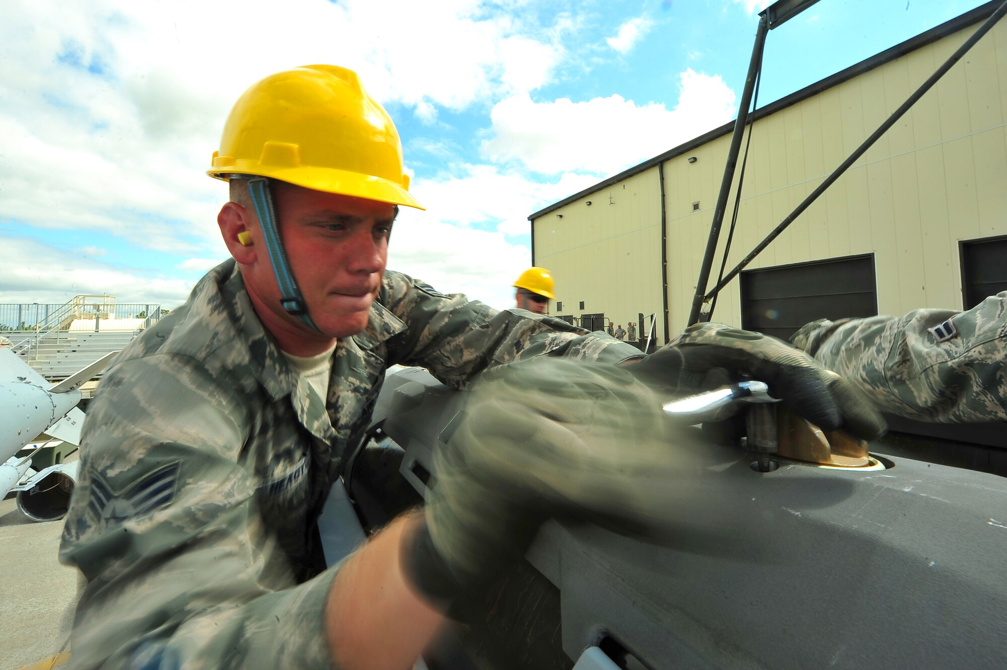 MINOT AIR FORCE BASE, N.D. – Senior Airman Ryan Heagy, 5th Munitions Squadron maintenance crew member, helps assemble unguided conventional bombs during the second annual Air Force Global Strike Command Global Strike Challenge here, Aug. 16. Minot Airmen from both the 5th Bomb Wing and the 91st Missile Wing participate in this year's AFGSC Global Strike Challenge during the months of June through November to showcase the world's premier bomber and ICBM force and to recognize outstanding AFGSC personnel and teams. (U.S Air Force photo by Senior Airman Jesse Lopez) (RELEASED)