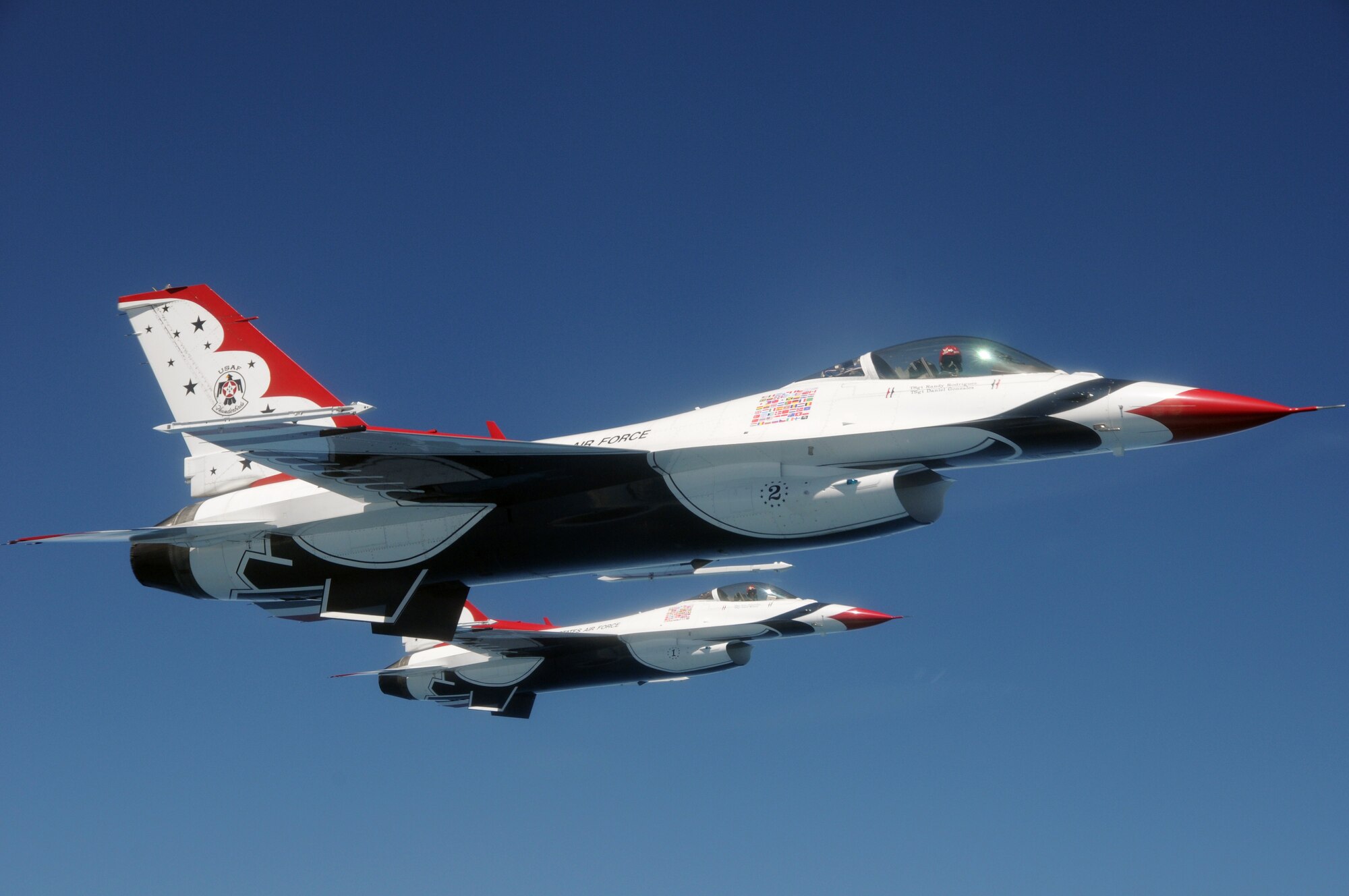 Capt. Ryan Riely (front) flying Thunderbird No. 2 and Lt. Col. Case Cunningham flying Thunderbird No. 1 form up alongside a KC-135R Stratotanker Aug. 11, 2011, during a refueling mission over the eastern United States while en route to an air show in Portsmouth, N.H. The tanker and its crew are from the New Hampshire Air National Guard’s 157th Air Refueling Wing at Pease Air National Guard Base.  The Thunderbirds are the U.S. Air Force's Air Demonstration Squadron and are based at Nellis Air Force Base, Nev. Cunningham is the squadron commander and leader of the Thunderbirds.  (U.S. Air Force photo/Staff Sgt. Curtis J. Lenz)