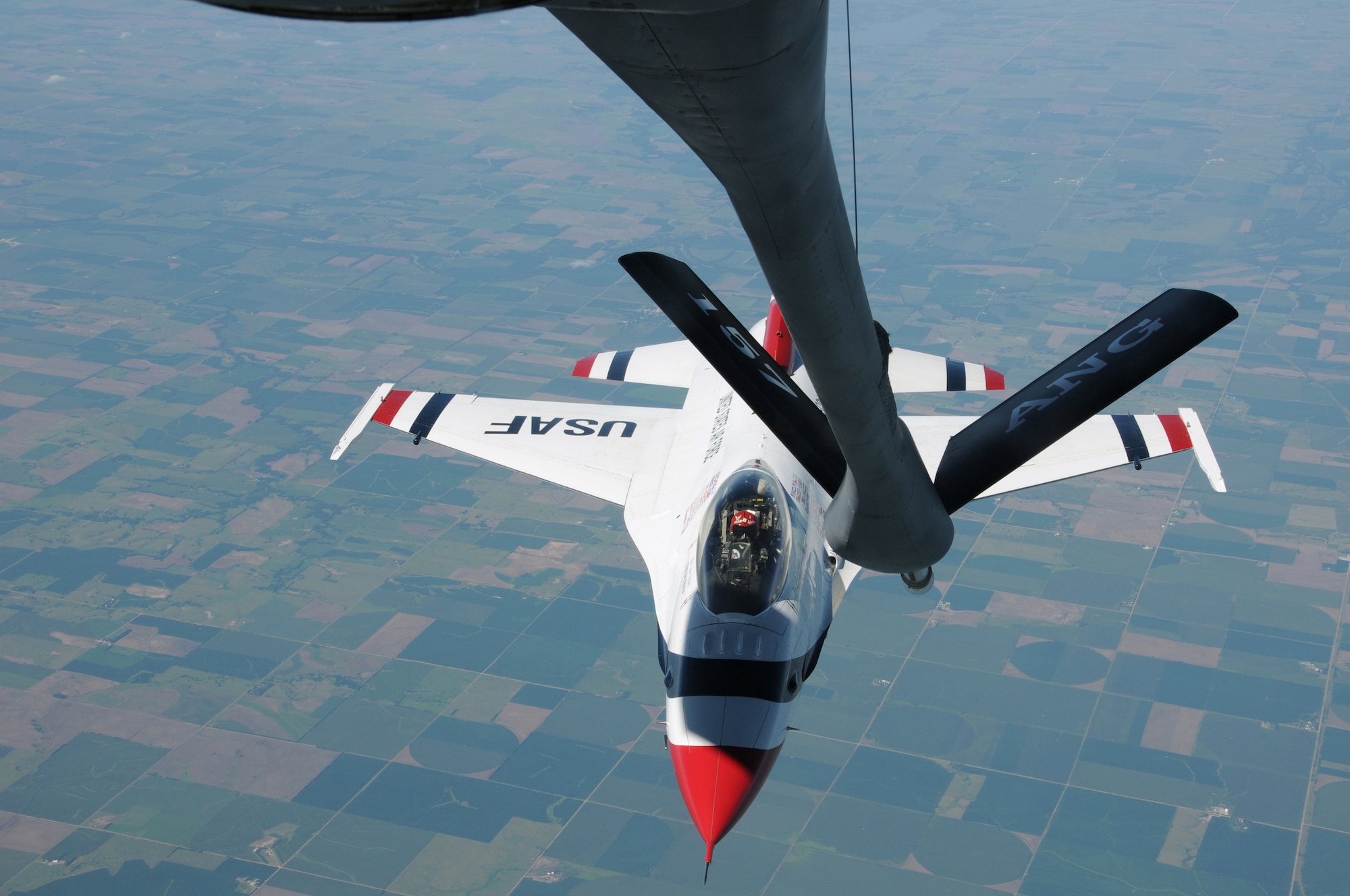 An Air Force Thunderbird pilot maneuvers his F-16 Fighting Falcon towards the boom of a KC-135R Stratotanker Aug. 11, 2011, during a refueling mission over the Midwest United States while en route to an air show in Portsmouth, N.H.  The tanker and its crew are from the New Hampshire Air National Guard’s 157th Air Refueling Wing at Pease Air National Guard Base.  The Thunderbirds are the U.S. Air Force's Air Demonstration Squadron and are based at Nellis Air Force Base, Nev.  (U.S. Air Force photo/Staff Sgt. Curtis J. Lenz)