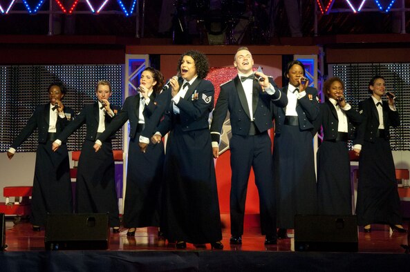 WILMINGTON, Mass. – Tops In Blue wraps up their show by performing a three-song tribute to the heroes of Sept. 11, 2001 before ending with “God Bless the USA” at the Aleppo Shriners Auditorium Aug. 10. Tops In Blue is the premier entertainment showcase of the U.S. Air Force. The performance also included the jazz of Nat King Cole and Billie Holiday, the rock 'n' roll sounds of Little Richard and Jerry Lee Lewis, the R&B of Marvin Gaye and Tammi Terrell, hits by Jennifer Lopez and Michael Franti, some inspirational country sounds and more. Their tour schedule spans more than 125 locations and also includes entertaining forward-deployed troops in various locations such as Iraq, Afghanistan and other Southwest Asia bases. (U.S. Air Force photo by Rick Berry)