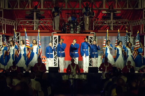 WILMINGTON, Mass. – Members of Tops In Blue open up to more than 1,000 audience members at the Aleppo Shriners Auditorium Aug. 10. Tops In Blue is the premier entertainment showcase of the U.S. Air Force. The performance also included the jazz of Nat King Cole and Billie Holiday, the rock 'n' roll sounds of Little Richard and Jerry Lee Lewis, the R&B of Marvin Gaye and Tammi Terrell, hits by Jennifer Lopez and Michael Franti, some inspirational country sounds and more. Their tour schedule spans more than 125 locations and also includes entertaining forward-deployed troops in various locations such as Iraq, Afghanistan and other Southwest Asia bases. (U.S. Air Force photo by Rick Berry)